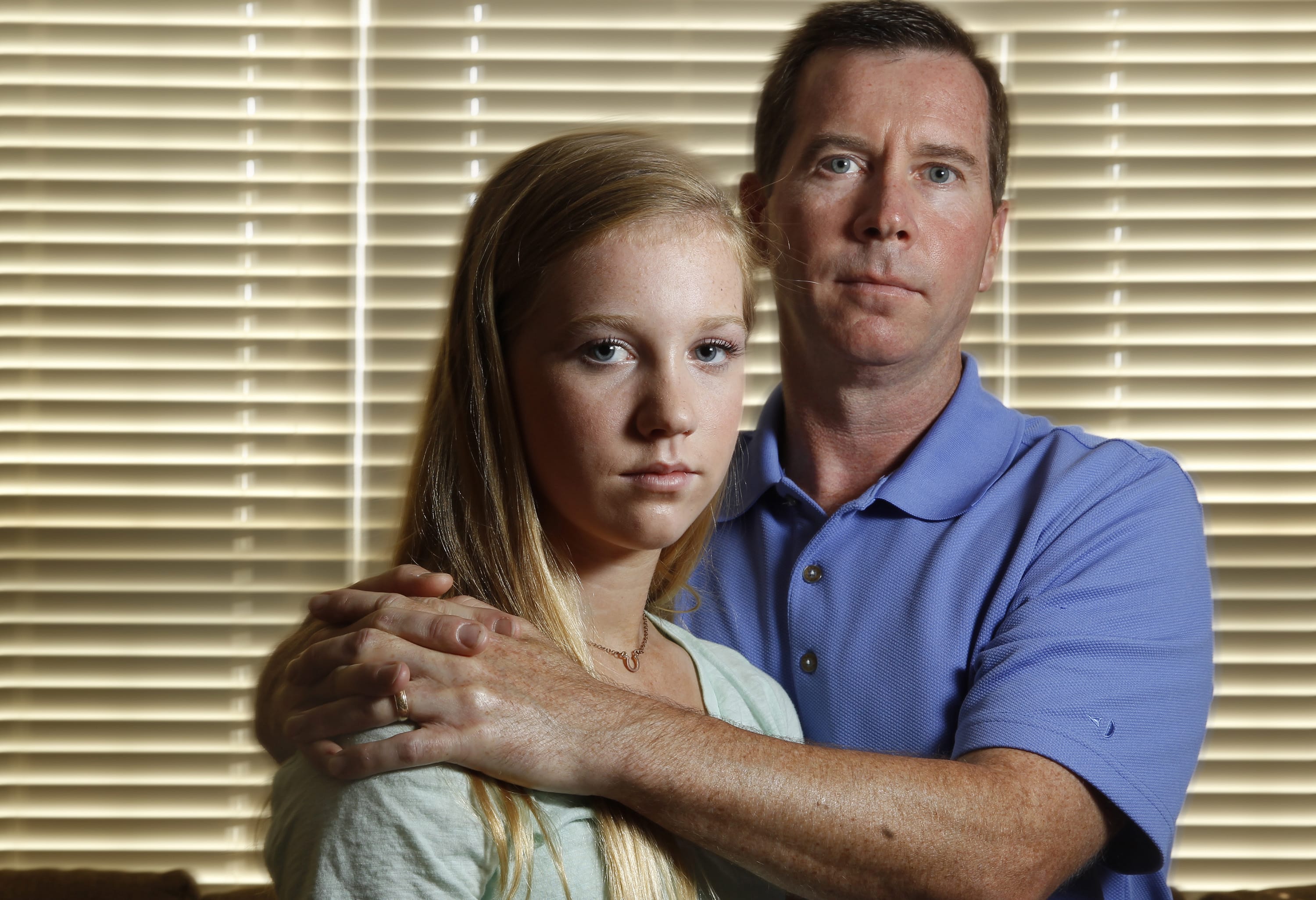Bridget Sharkey, 14, left, and her father Mike Sharkey, who is trying to raise awareness about the condition called Misophonia, an understudied condition in which repetitive noises, such as chewing, sends a person into flight or fight mode.