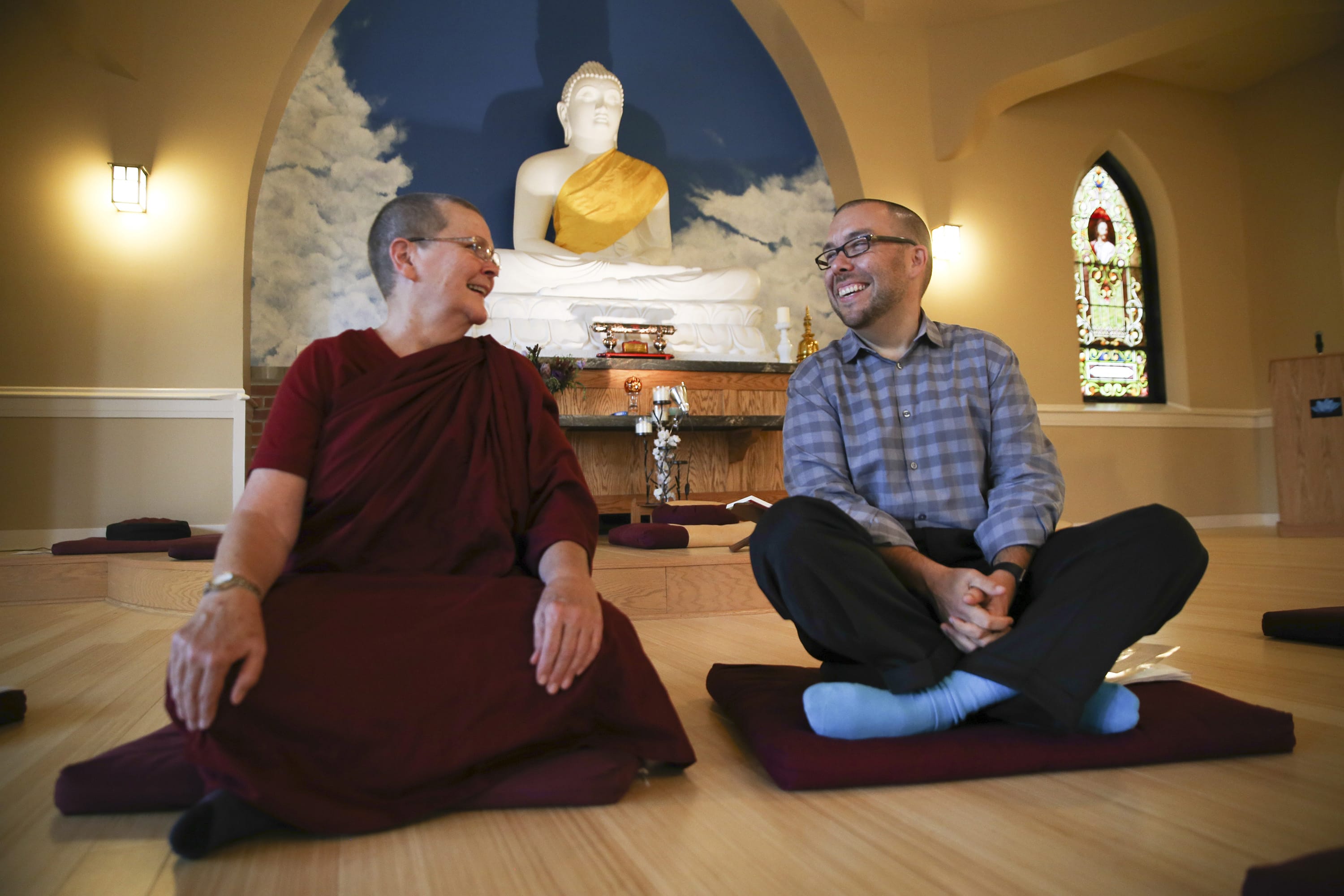 Vimala Bhikkhuni, left, and Tyler Lewke pose for a portrait in the Blue Lotus Buddhist Temple on Sept. 2, 2015 in Woodstock Ill. Buddhist groups can offer lessons in meditation and other teachings to help lead people to sobriety.