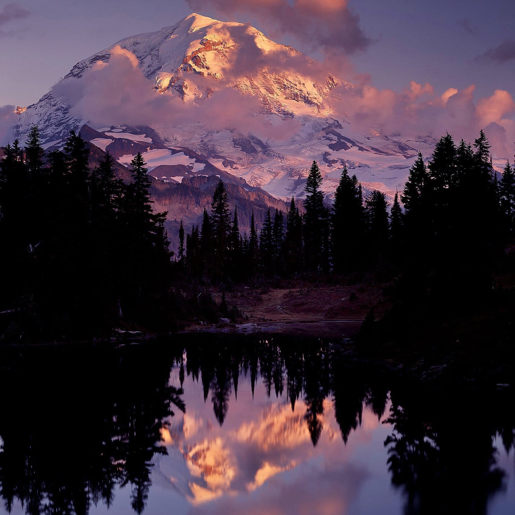 Seattle Times files
This year's &quot;Washington State Visitors Guide&quot; features &quot;trips of a lifetime,&quot; which includes a climb to the 14,411-foot summit of Mount Rainier.