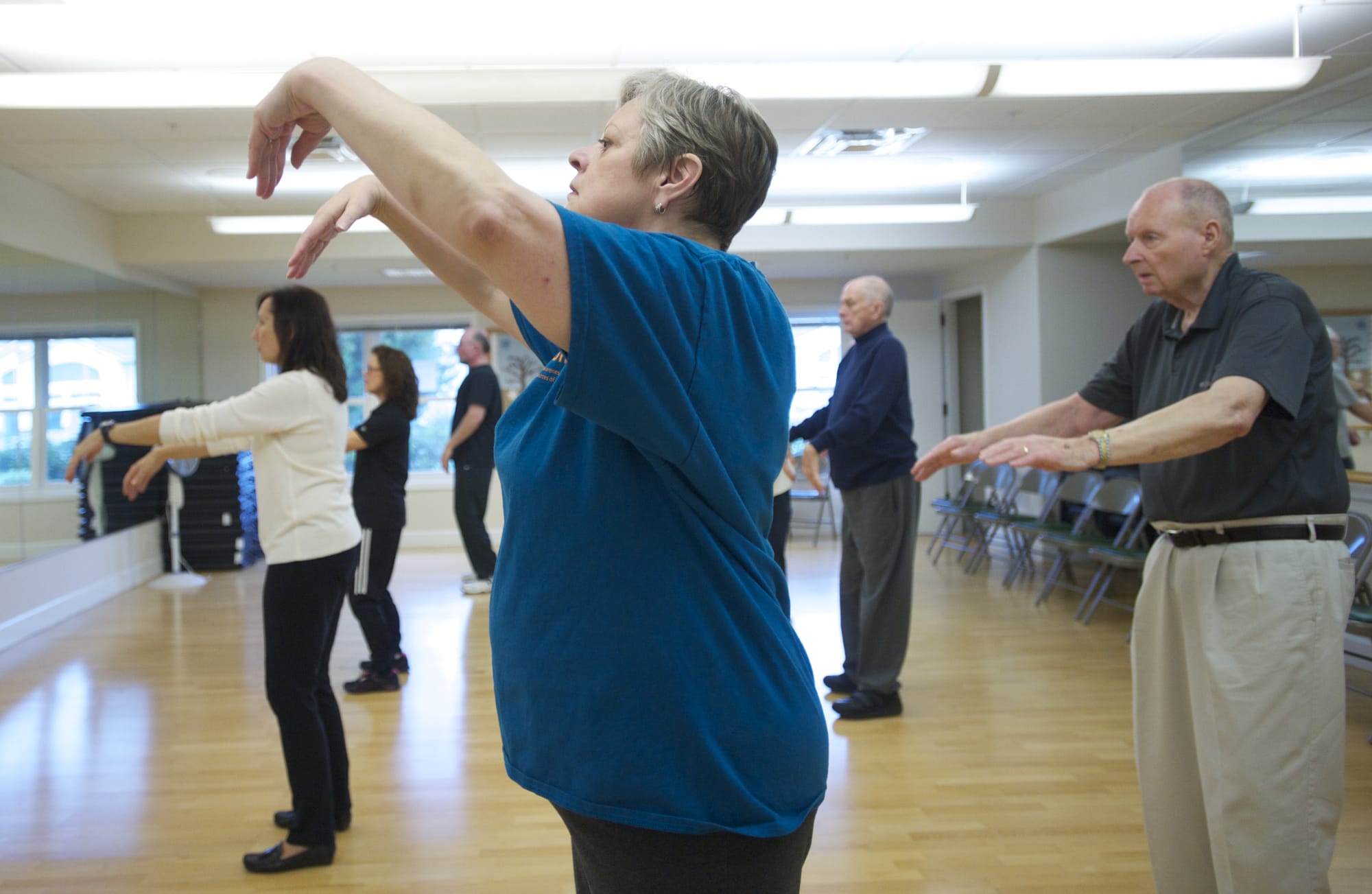Linda McKenzie, 65, participates in a Tai Chi class for seniors at Touchmark at Fairway Village in Vancouver.