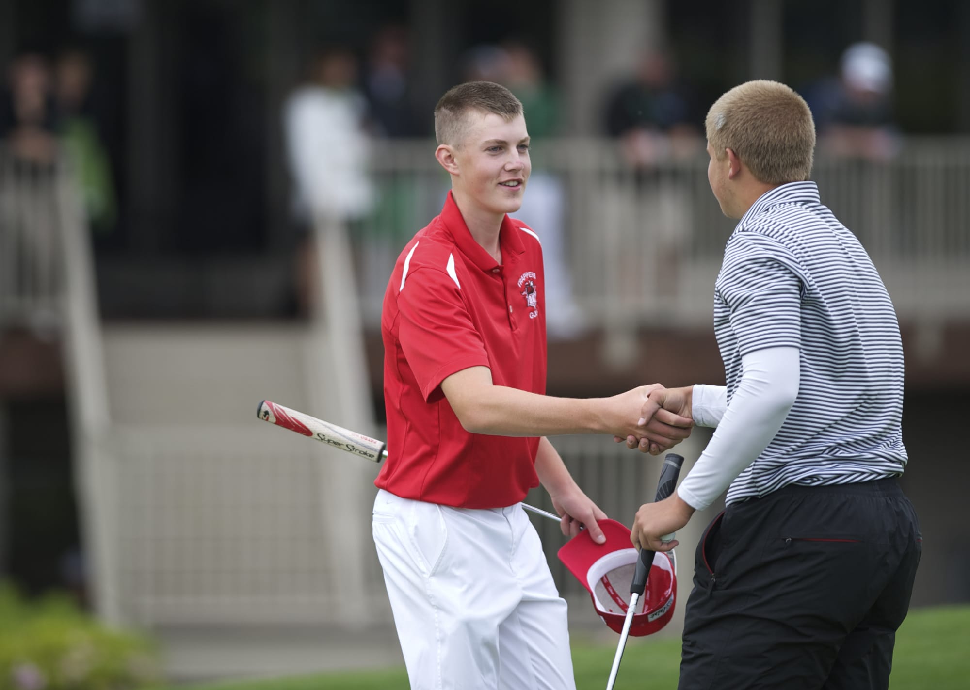 Spencer Tibbits of Fort Vancouver, left, who won the 3A boys title, shakes hands with Columbia River's Spencer Long who tied for fifth at Tri-Mountain Golf Course on Thursday May 29, 2014.