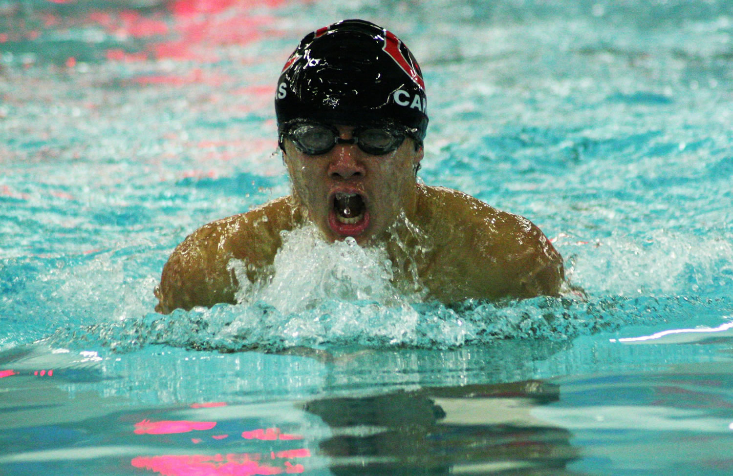 John Utas charges through the water in the 100-meter breaststroke.