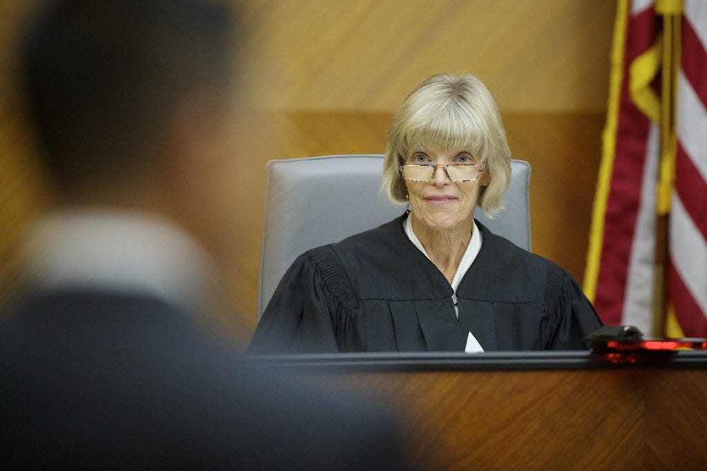 Judge Barbara Johnson checks with attorneys before starting up an afternoon court session in 2012. Presiding Judge Johnson received her law degree from the University of Washington Law School and was admitted to the bar in 1975. She was sworn in as the first female Superior Court judge for Clark County in January 1987.