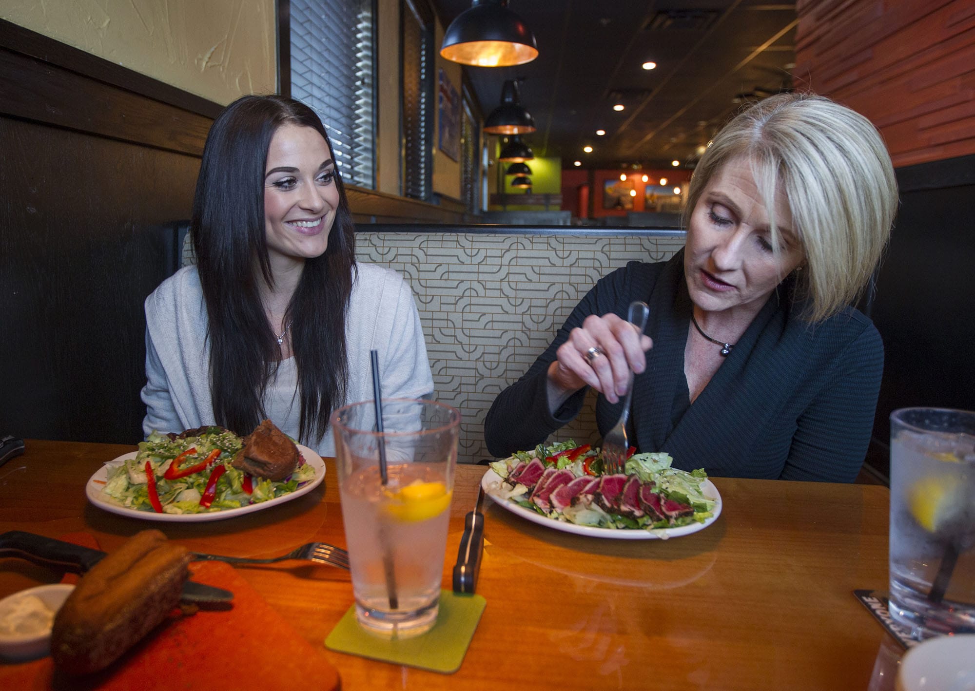 Alexis Colson, left, and her mother Mary Thompson speak about bulimia and healthy eating habits during a recent interview at the Outback Steakhouse in Vancouver.