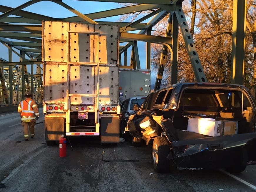 Emergency responders respond to a six-vehicle collision on I-5 at the North Fork Lewis River bridge.