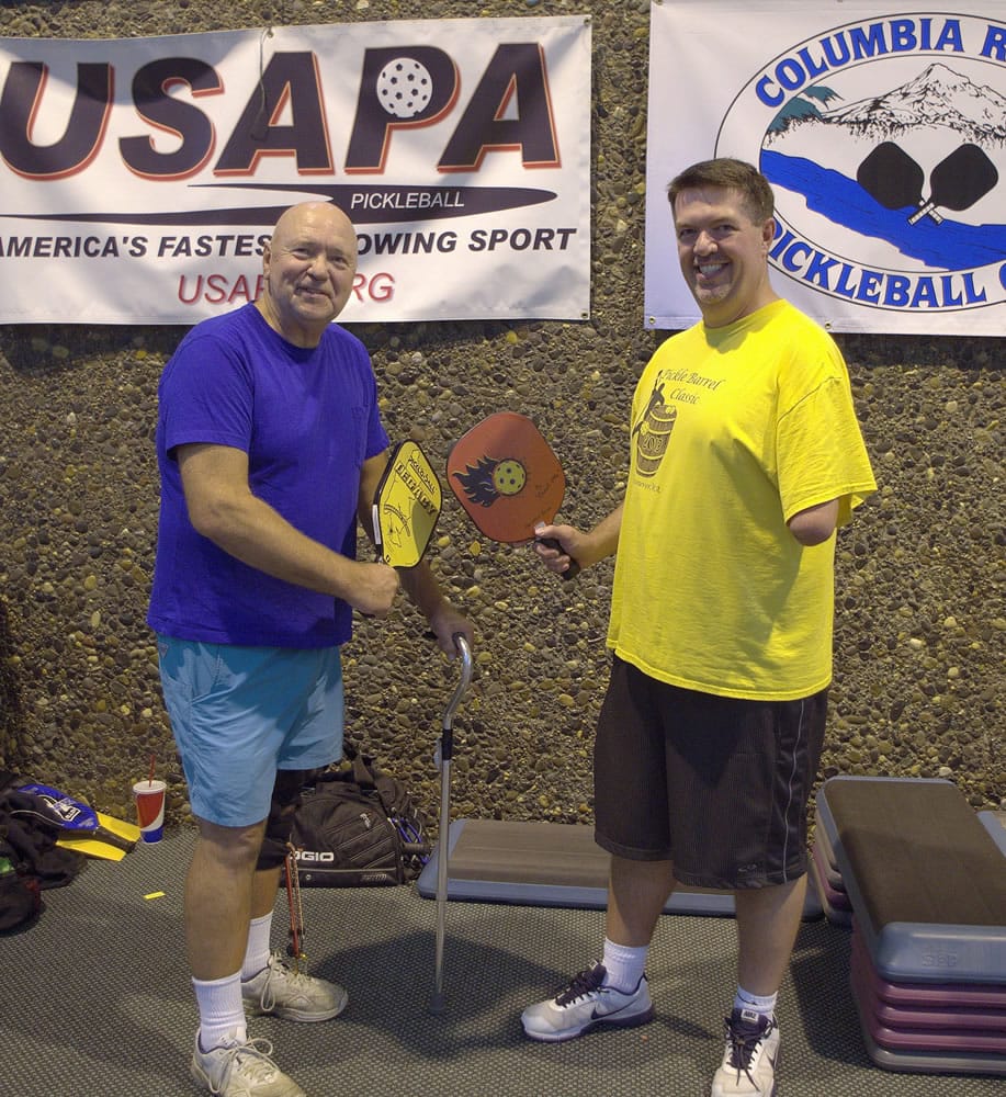 Walt Pisarczyk (left) and Mike Hoxie (right) are among the individuals who enjoy the sport of pickleball, despite their physical ailments. Pisarczyk has drop foot, and Hoxie was born without a lower left arm.
