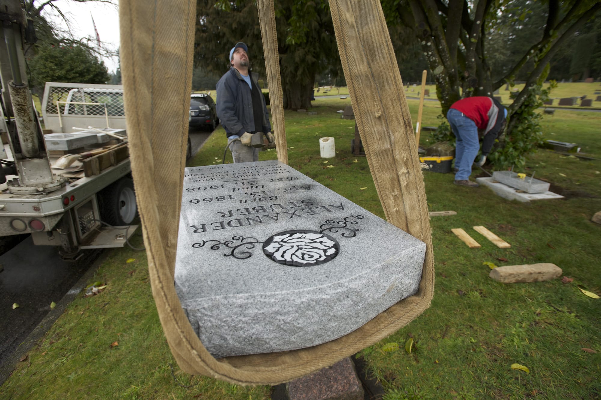 A headstone for Alexander Stuber, who died in 1908, is installed Jan. 31 in Camas Cemetery.