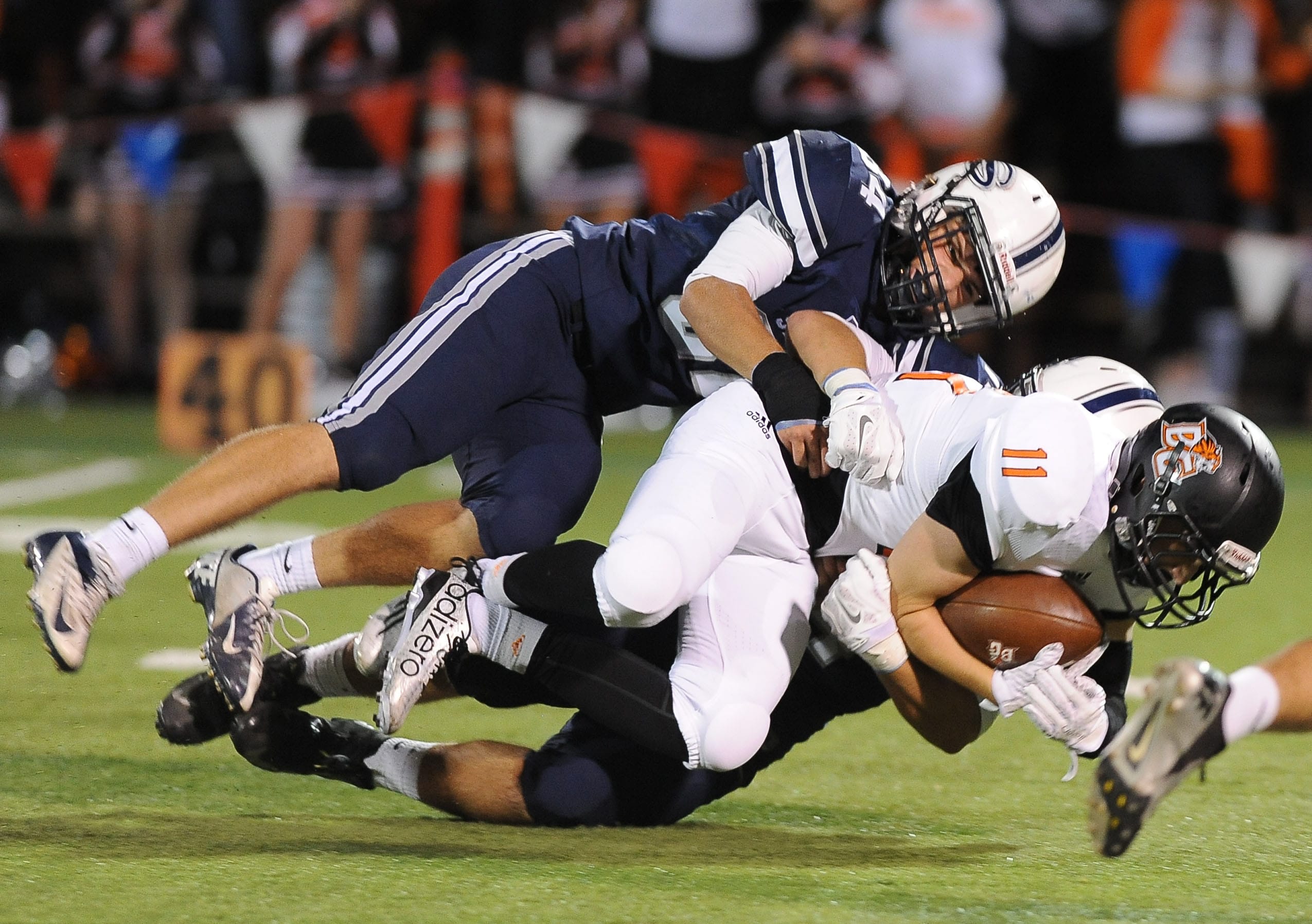 Battle Ground's Kyle Cahoon is tackled by Skyview's Devon Whitley during a game at the Kiggens Bowl in Vancouver, Friday September 17, 2015.