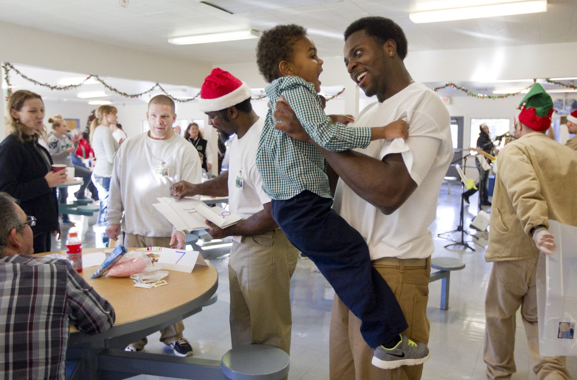 Tyrell Bennett, 23, embraces his son, Tyrell Bennett Jr., 3, Sunday at the Larch Corrections Center in Yacolt. The two hadn't seen each other for 16 months. &quot;If only I knew then what I know now,&quot; he said.