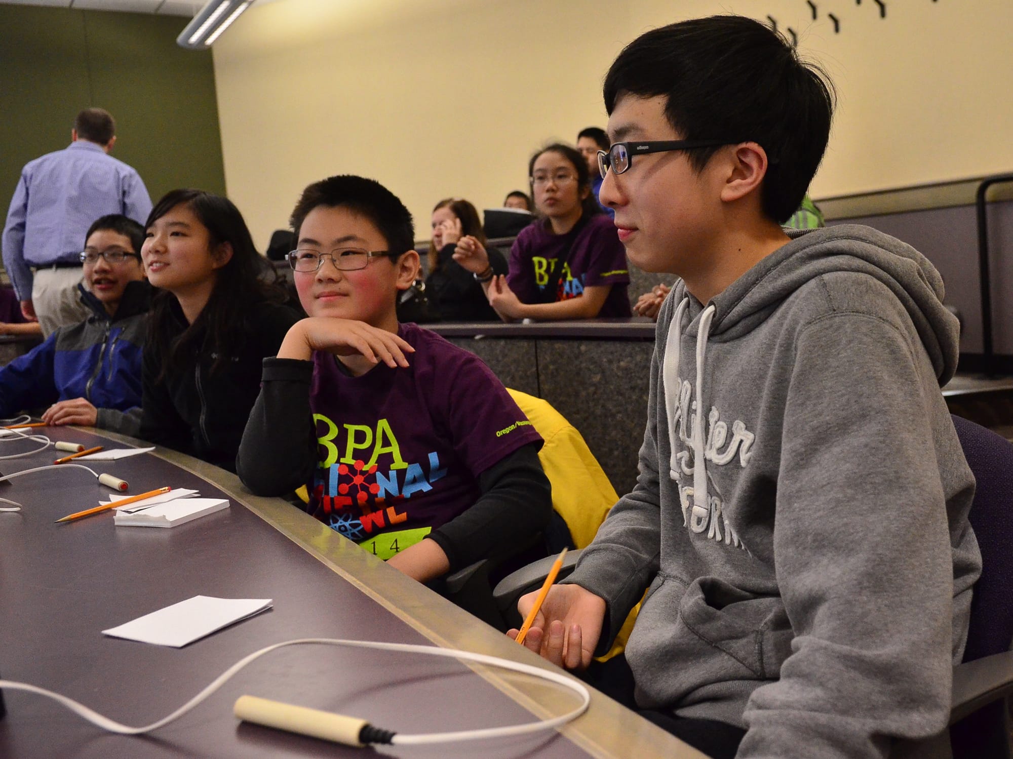 From left, Edmond Hsu, Sabrina Wang, Phillip Meng and Enoch Tsai of Shahala Middle School in Vancouver get ready for a round Saturday during the middle school competition for the BPA Regional Science Bowl at the University of Portland.
