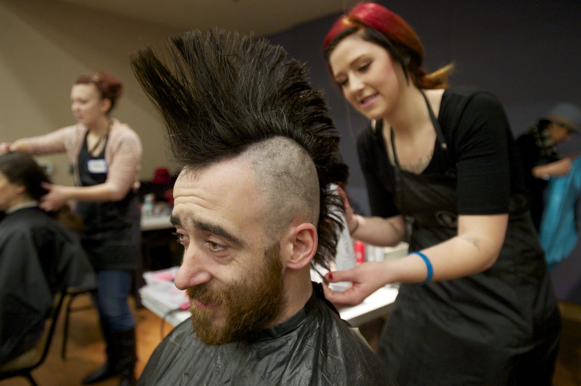Jeff Roberson, 27, who declared himself &quot;a punk rocker through and through,&quot; receives a fresh mohawk Thursday from hairstylist Sarah Warman of the J.C.