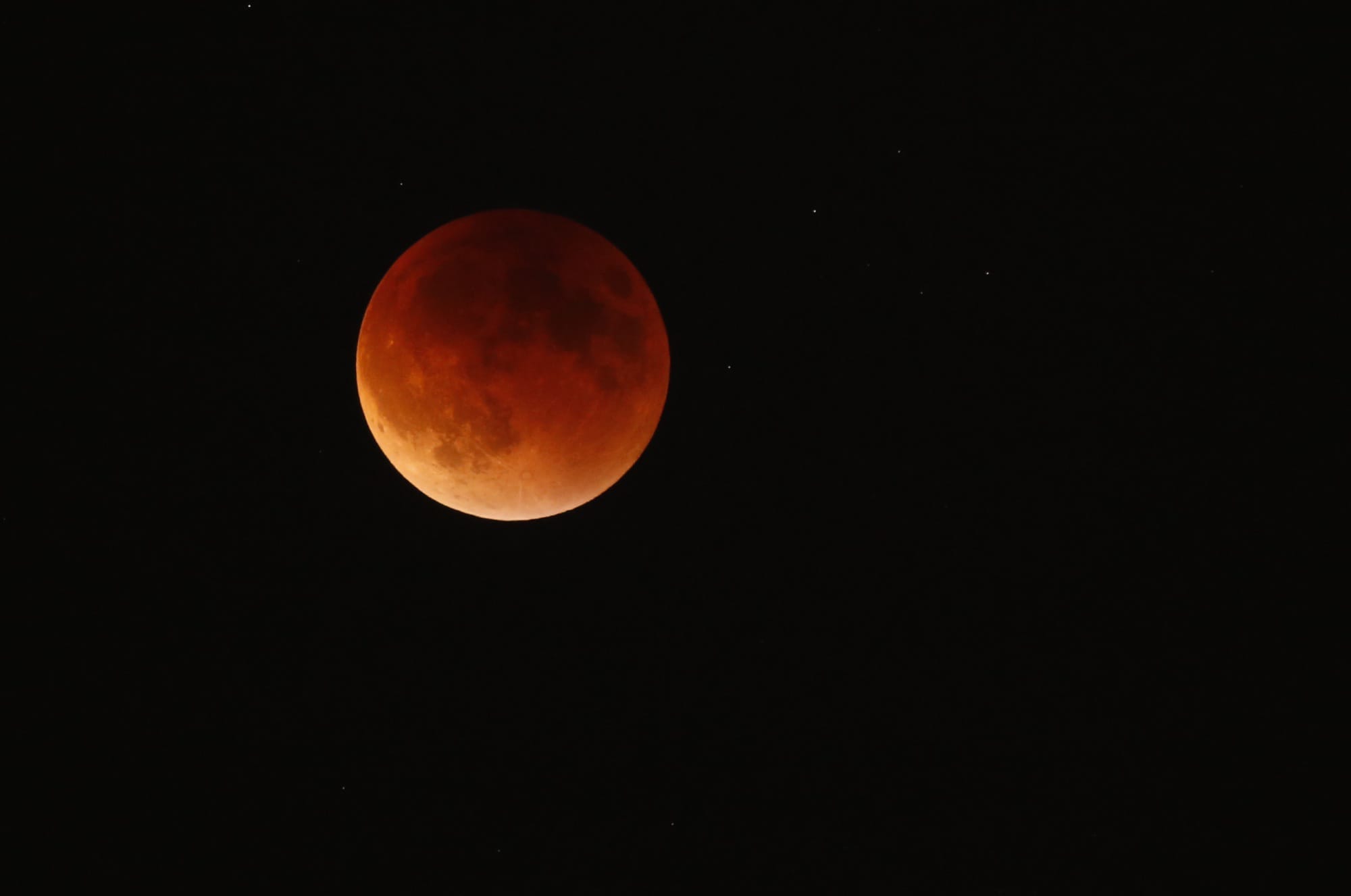 The lunar eclipse is seen from Hazel Dell on Sunday night. It was the first time since 1982 that the eclipse, known as a blood moon, appeared while the moon was as close as it gets to the earth this year.