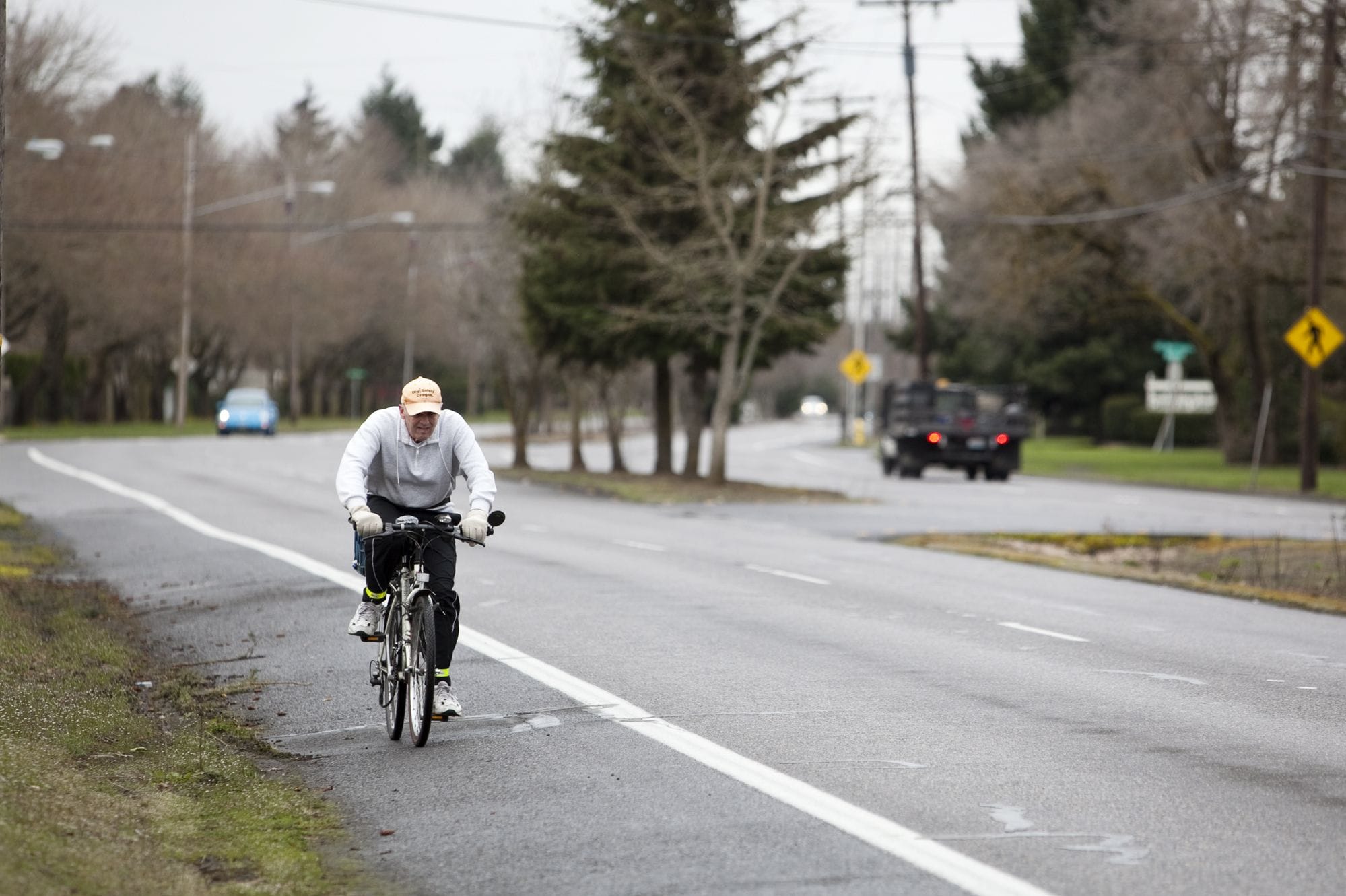 A bicyclist rides in a bike lane on MacArthur Boulevard in 2011. Three years later, bike advocates question why plans for Vancouver's downtown waterfront development don't include bike lanes.