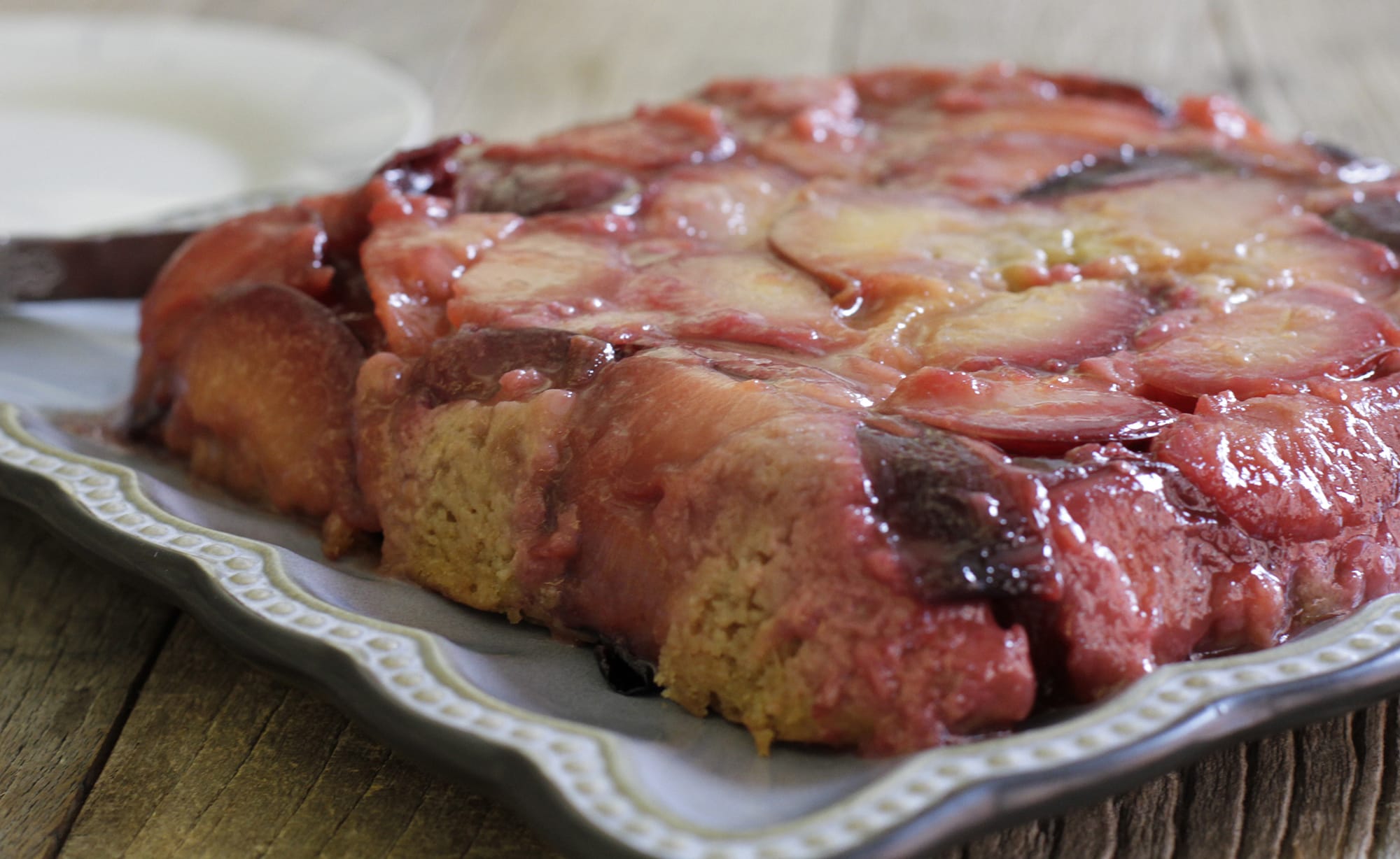 Plum upside-down cake can be elegant when you use a not-too-sweet batter made tender with olive oil and yogurt.