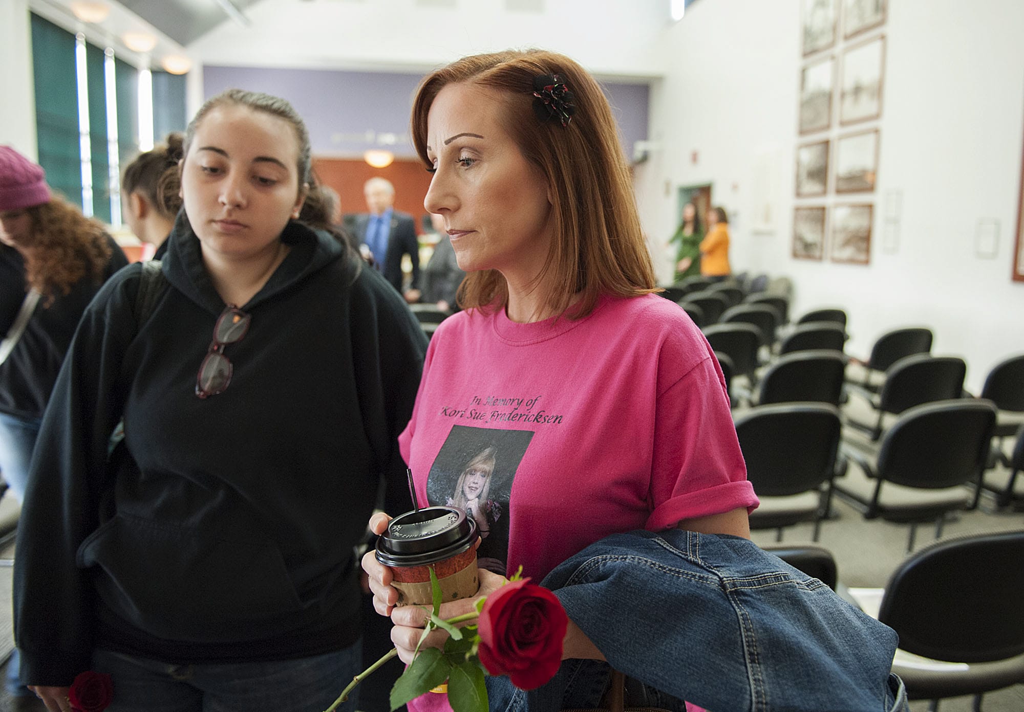 Tammi Murphy of Vancouver, center, wears a t-shirt in honor of the memory of her sister, Kori Fredericksen, while joined by daughter, Destiny Murphy, left, Wednesday morning, Sept. 16, 2015, at the Vancouver Clark County Public Service Center.