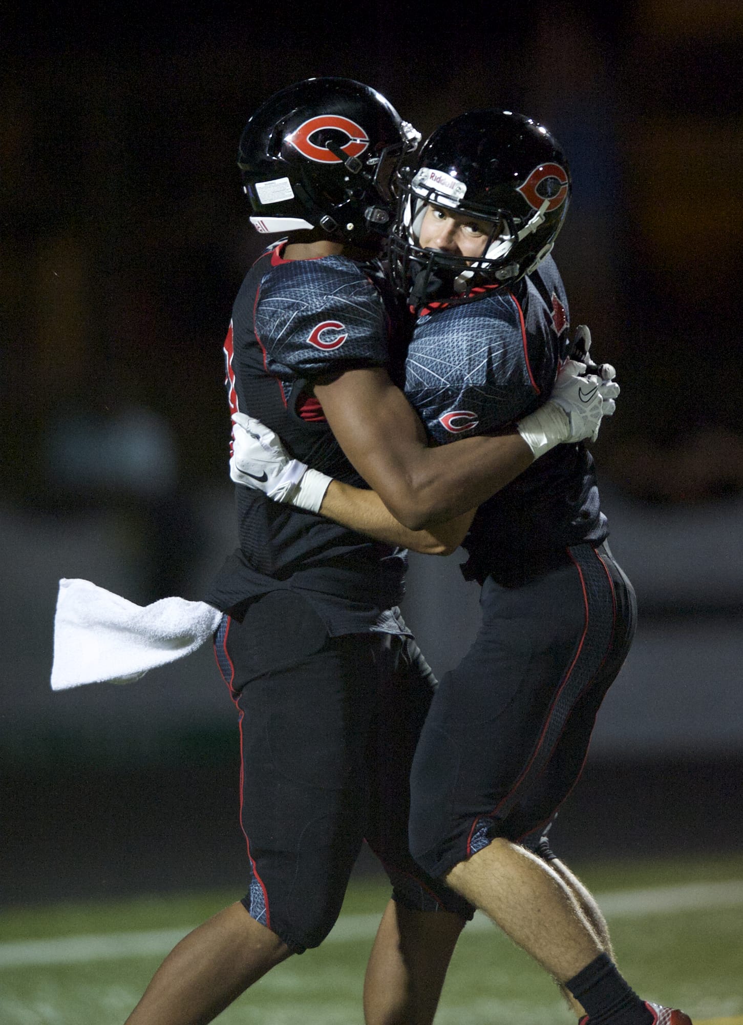 Zachary Kaufman/The Columbian
Jared Bentley, right, and James Price celebrate Bentley's scoring catch, the first Camas touchdown of the season.