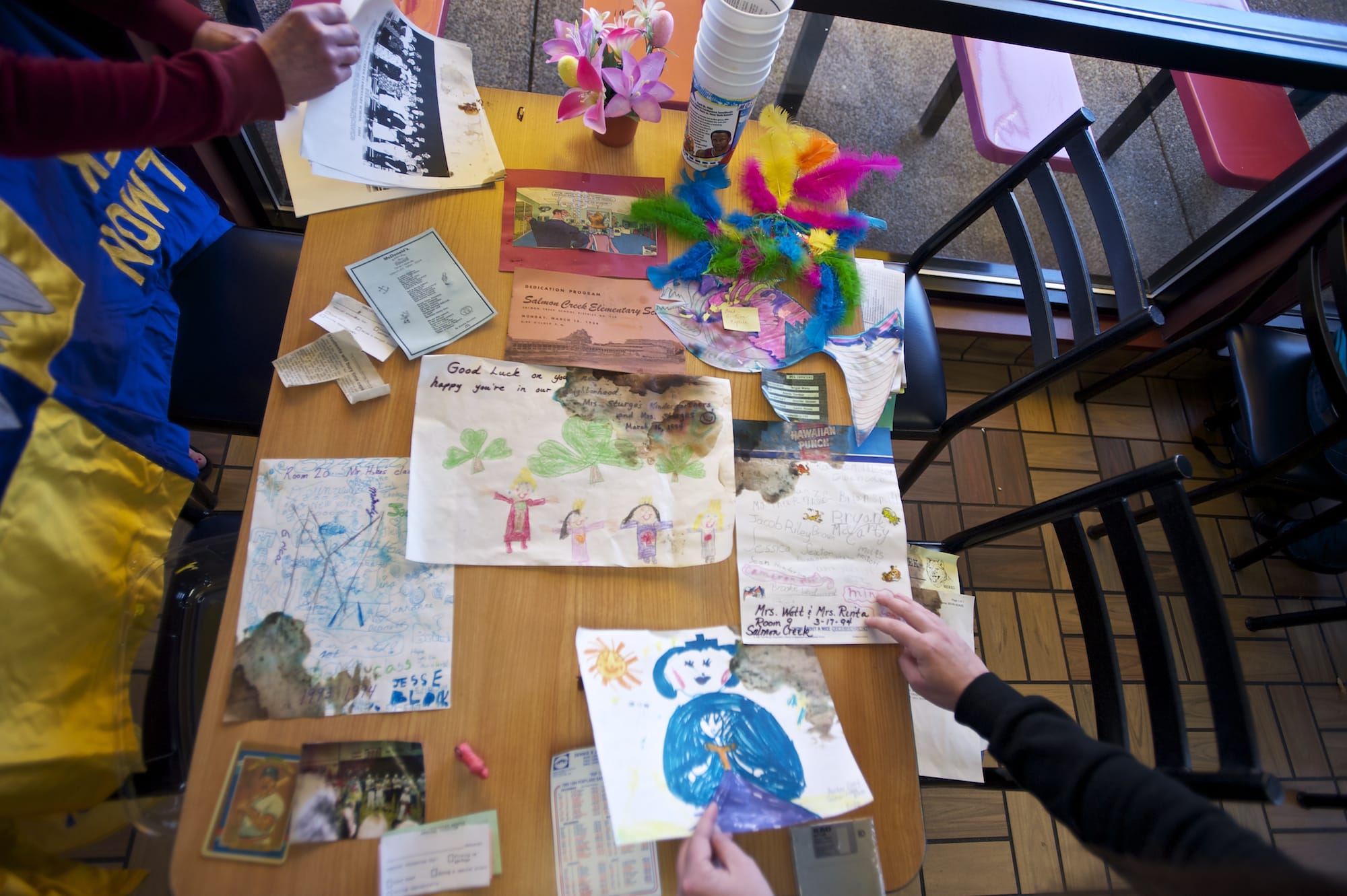 Items unearthed from a time capsule that Salmon Creek Elementary School students and staff buried in 1994 are displayed Sunday at the McDonald's in Salmon Creek.