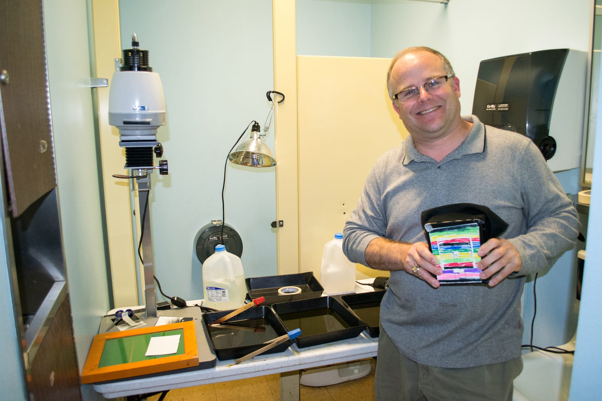 Ridgefield: Photography teacher Mark Cook shows off a homemade pinhole camera and his makeshift darkroom in an unused faculty restroom at Ridgefield High School.