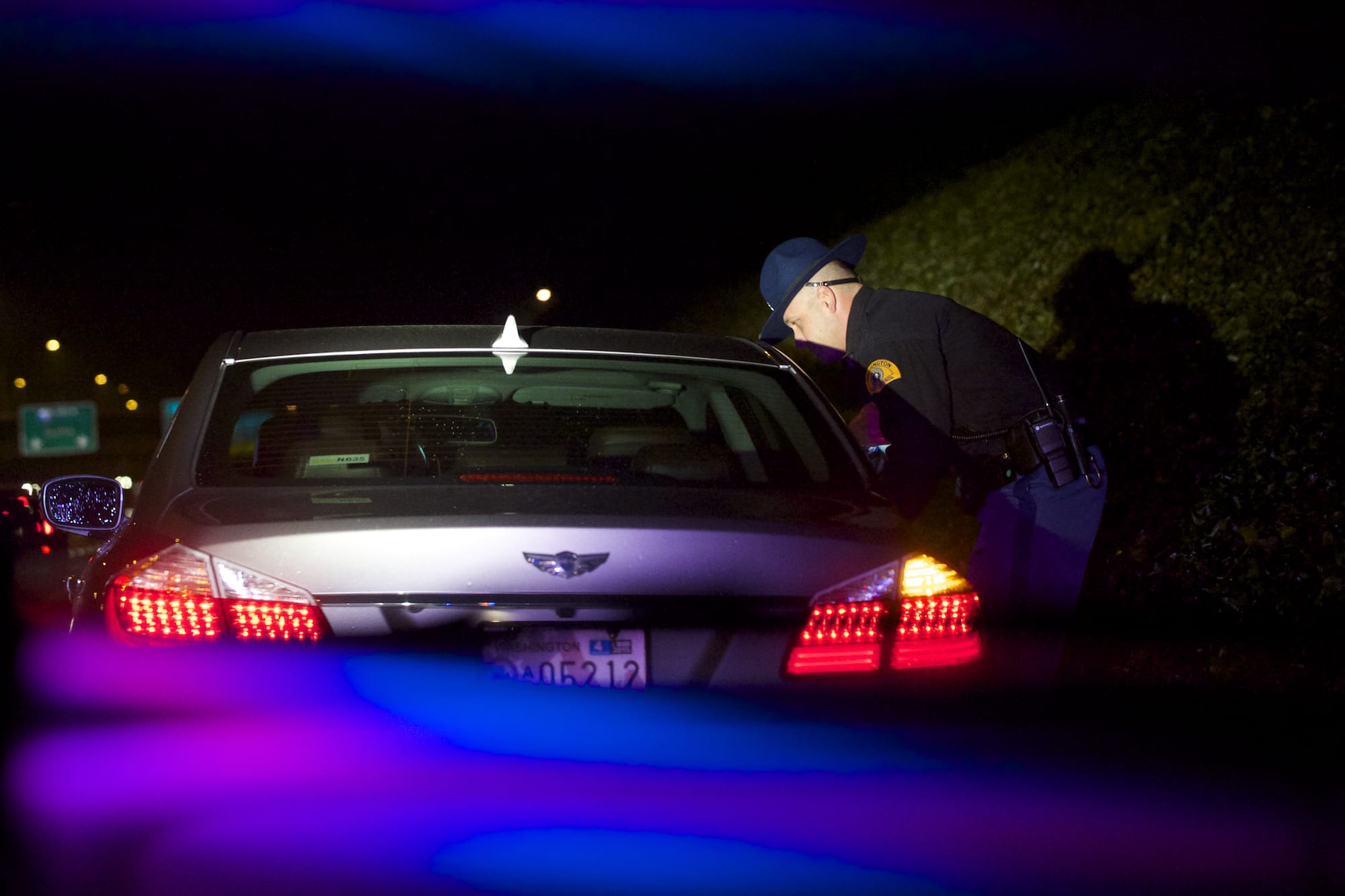 Washington State Patrol Sgt. Grant Clark makes a traffic stop on Interstate 5 northbound as part of the Night of 1000 Stars impaired driver emphasis patrol Friday.