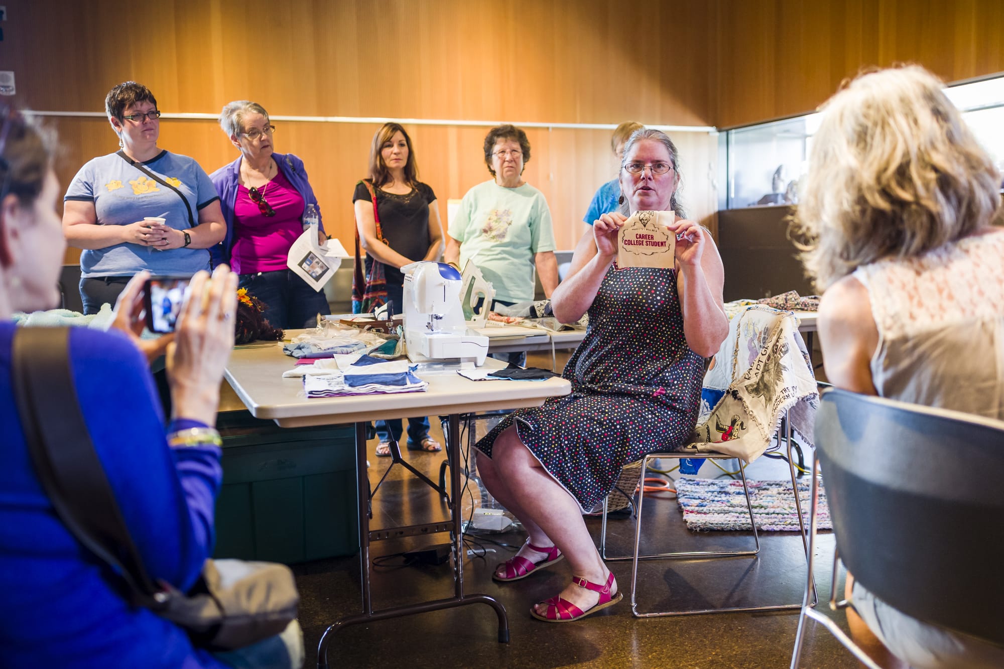 Marci Macfarlane explains how to make quilts from old t-shirts at the Vancouver Community Library Sunday during a workshop about how to repurpose vintage or used clothing into something more useful.