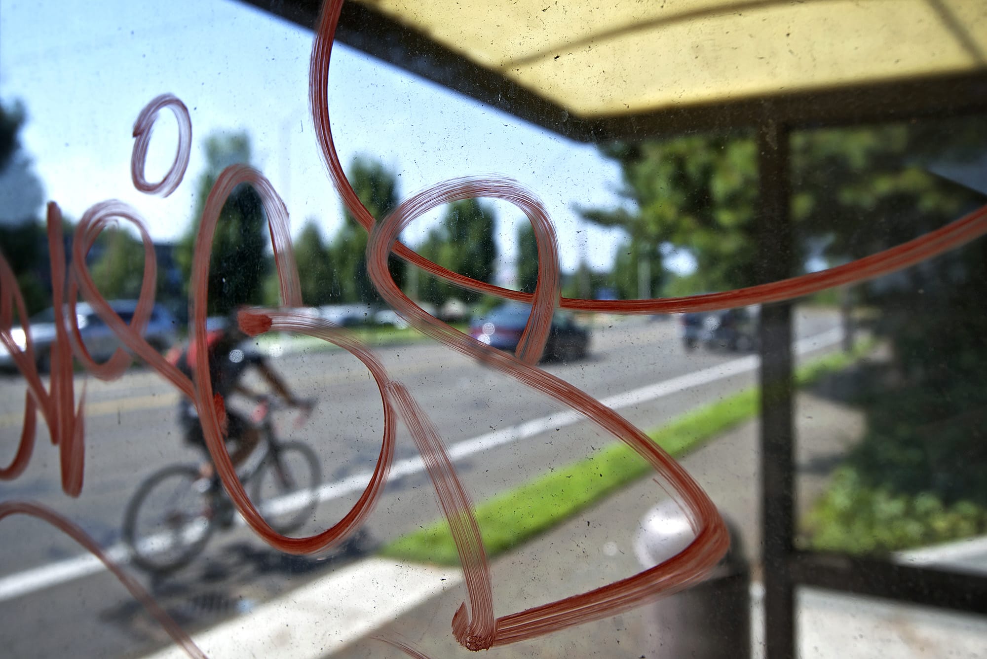 A tagged bus shelter on Northeast 18th Street and 65th Avenue illustrates a growing graffiti problem in Vancouver, which the city council hopes to curb with a new set of codes adopted Monday.