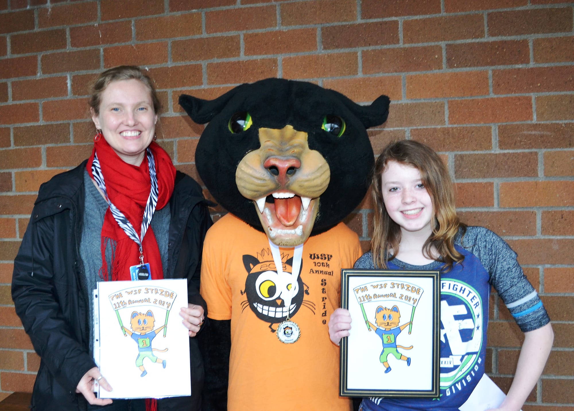 Washougal: Jemtegaard Middle School eighth-grader Taylor Grasseth poses with her art teacher, Gabrielle Iverson, and the Stride Cat school mascot.