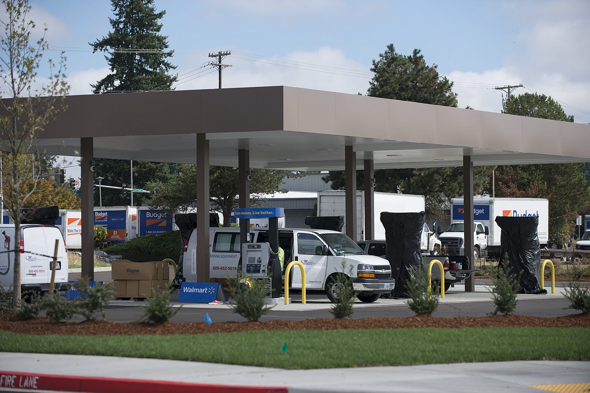 Workers help set up the fueling station at the new Wal-Mart Supercenter in Orchards. The fueling station will open Sept. 23, with a grand opening set for Oct. 3.