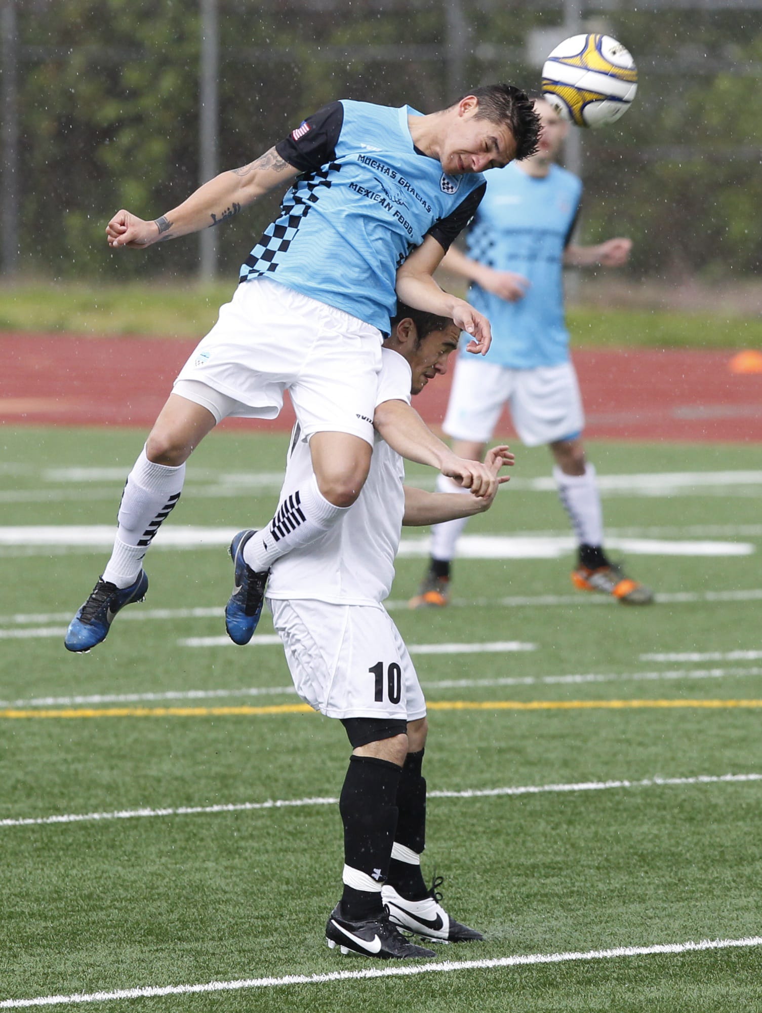 Vancouver's Bryanth Garcia-Junco heads ball over Westsound's Cameron Stone (10) during Sunday's 4-0 Vancouver victory.