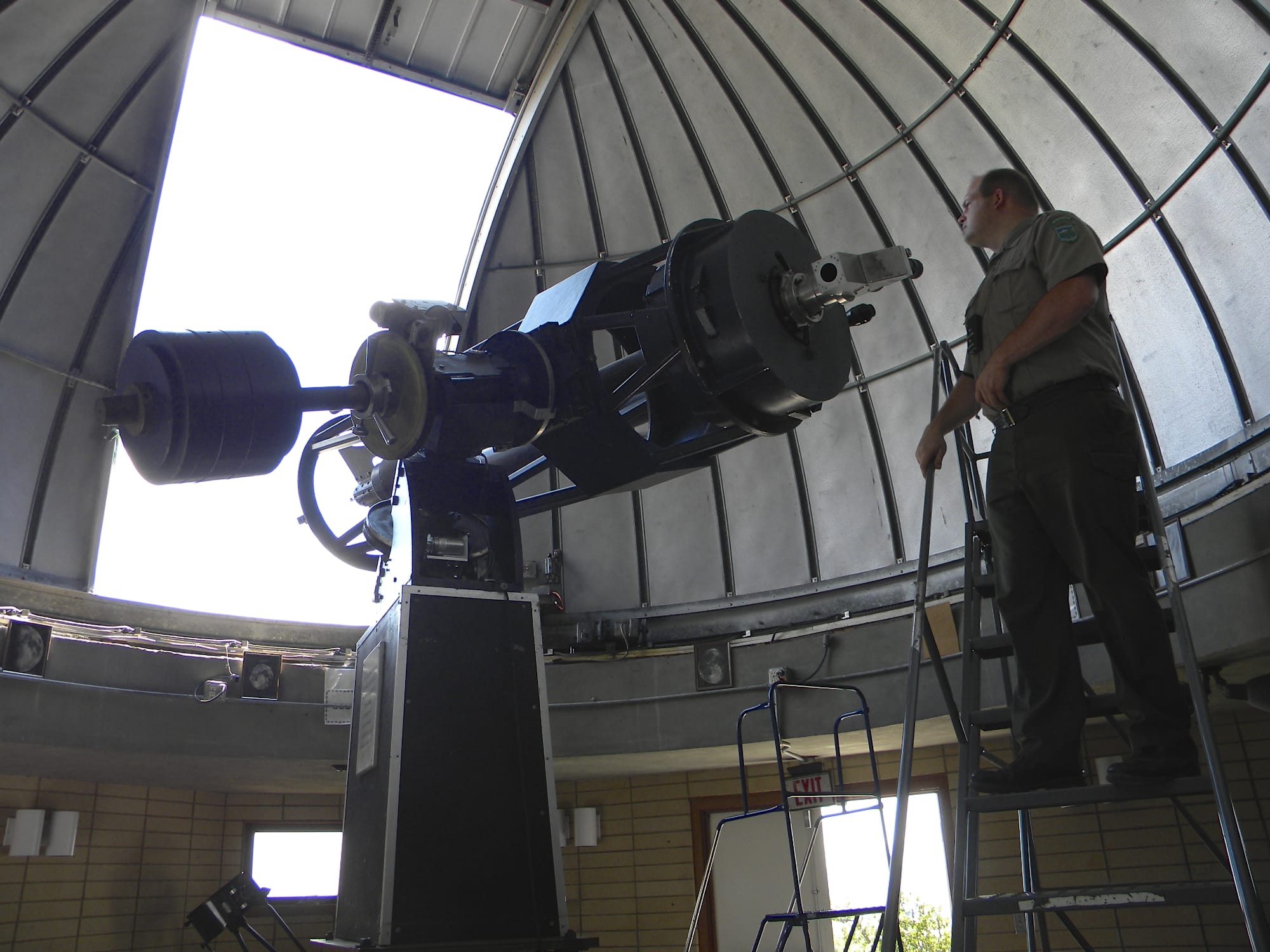 Troy Carpenter, Goldendale Observatory State Park interpretive specialist, looks through a telescope that was built by four amateur astronomers from Vancouver at space donated by Clark College.