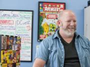 Chris Simons, owner of I Like Comics, shares a laugh with a customer at his Vancouver comic book shop Thursday afternoon, August 27, 2015.