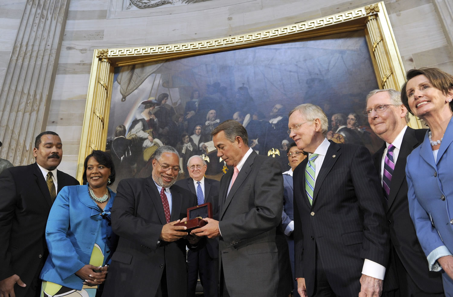 House Speaker John Boehner presents historian Lonnie Bunch III with a Congressional Gold Medal in honor of Dr. and Mrs. Martin Luther King Jr.