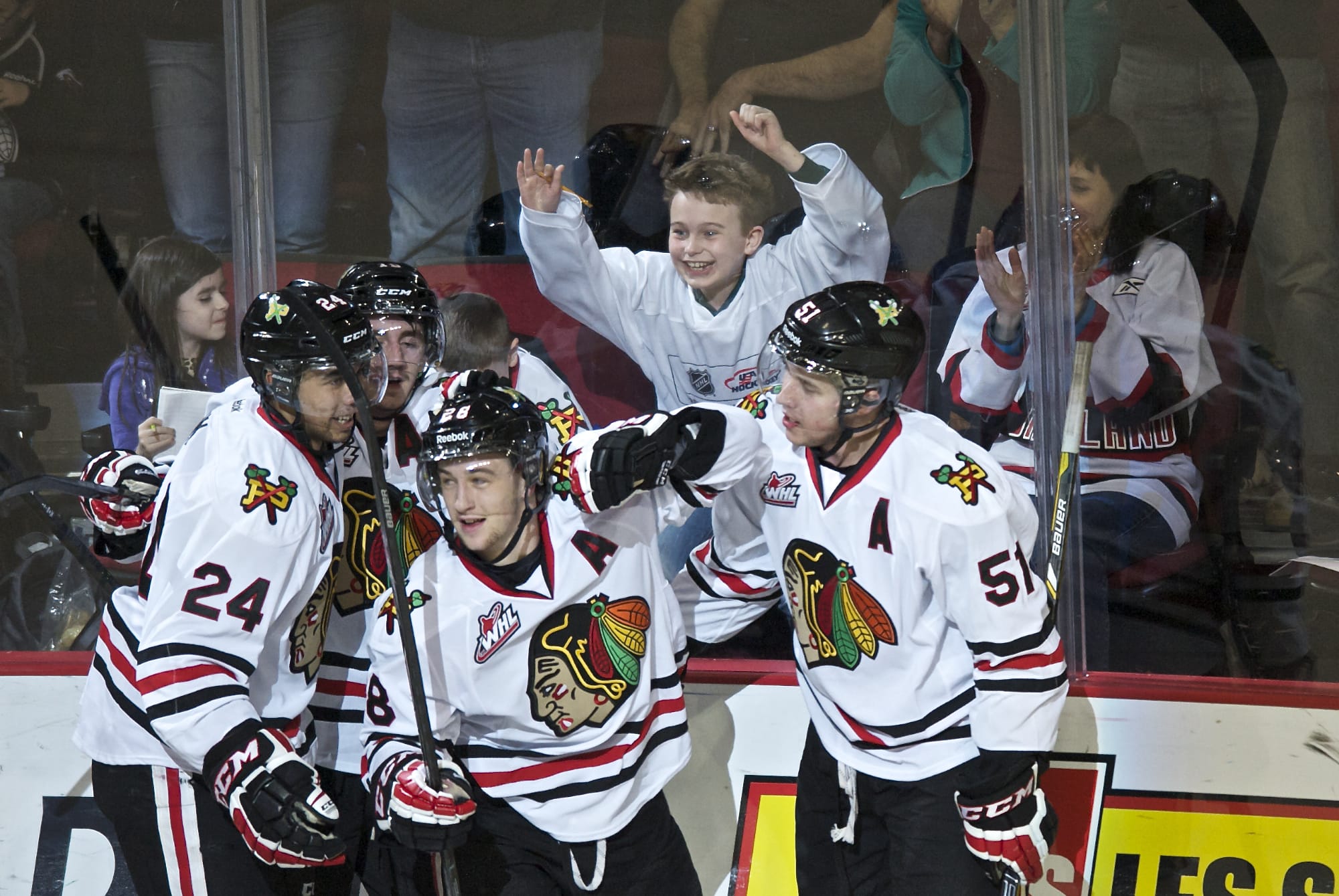 Winterhawks Brendan Leipsic, center, celebrates his first goal of the evening against the Vancouver Giants in the first period of game one of their best of seven series at the Moda Center on Friday March 21, 2014.