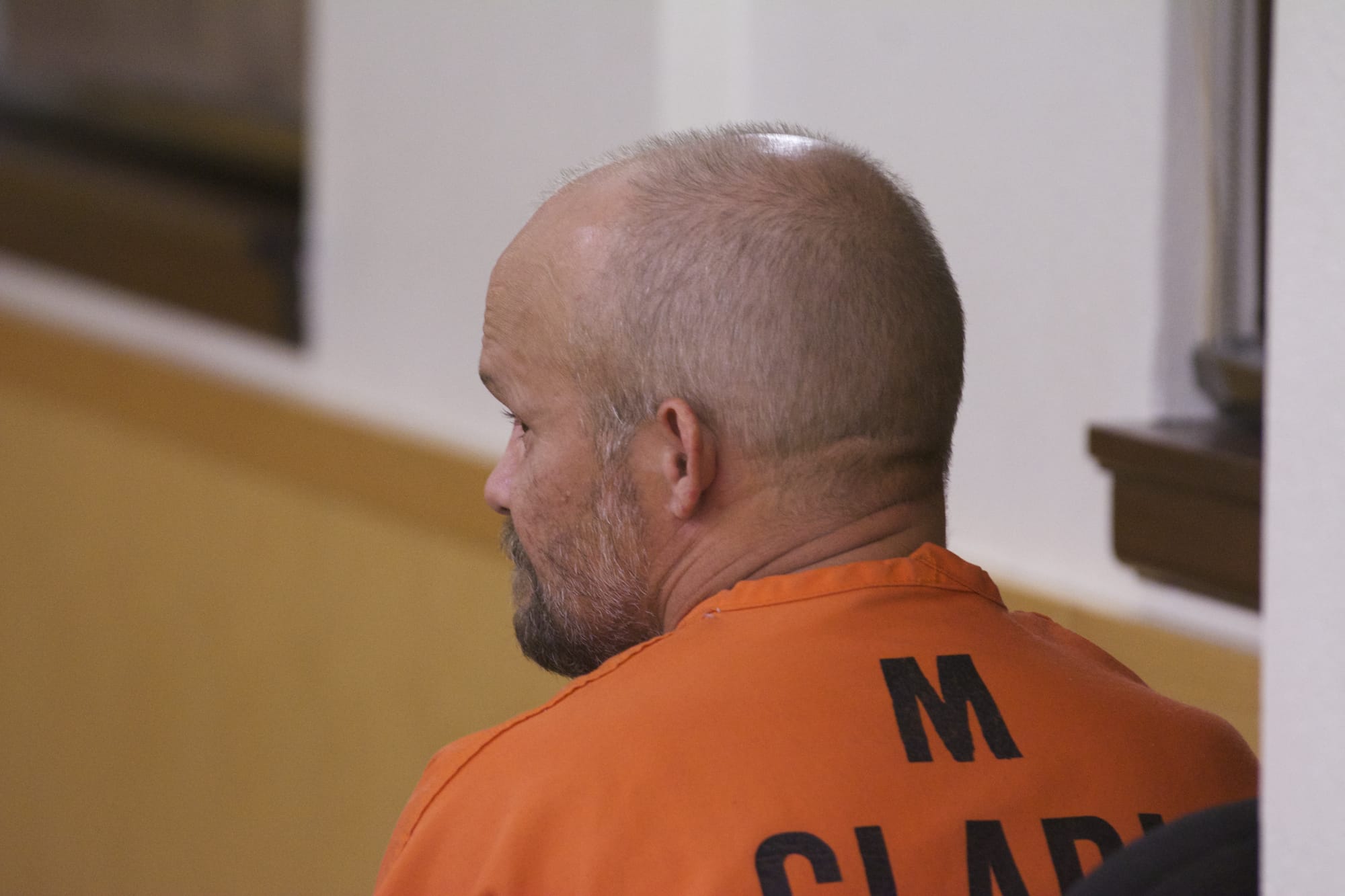 Ronald Ahlquist, 45, of Brush Prairie sits in Clark County Superior Court on Friday before entering a plea of not guilty to manslaughter of his elderly father, who died of malnutrition.