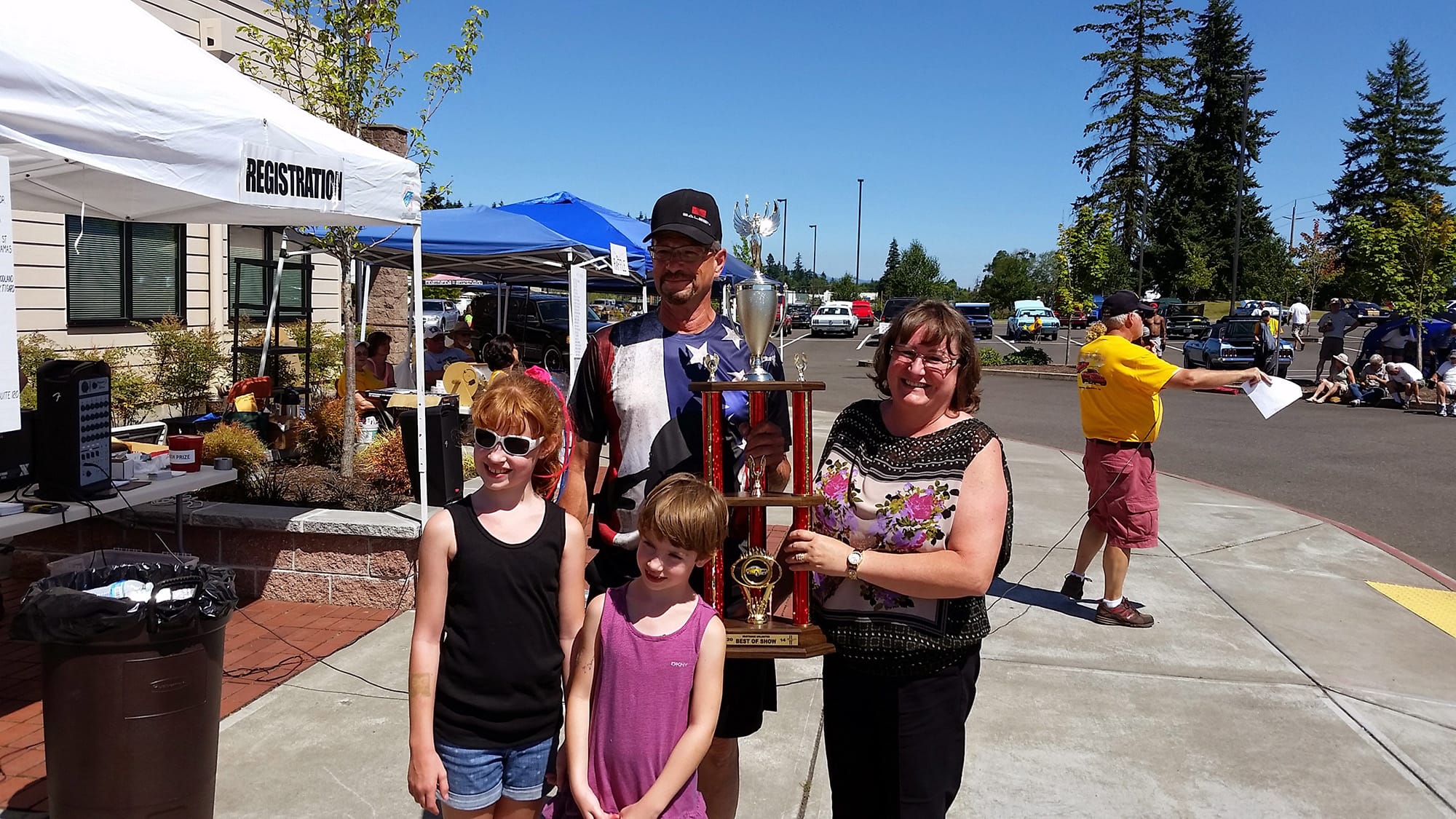Northeast Hazel Dell: Mike and Kelly Sparano hold a Best in Show trophy, which they won during the 28th-annual Mustang Stampede Car Show on July 26 at the First Church of God in Vancouver.