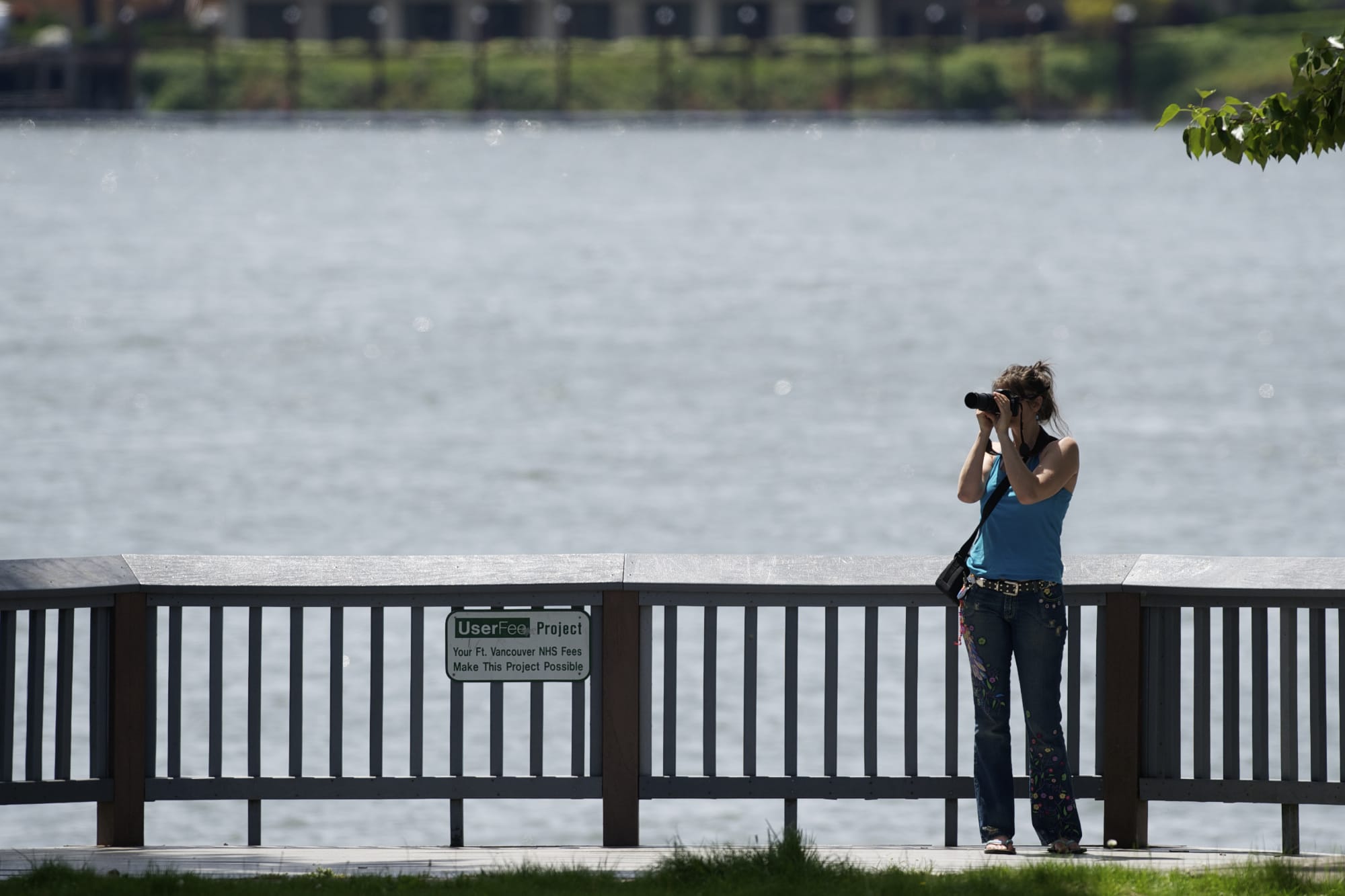 Jennifer Iverson of Vancouver takes advantage of the summery weather this week for photography on the Columbia River at Waterfront Park on Monday.