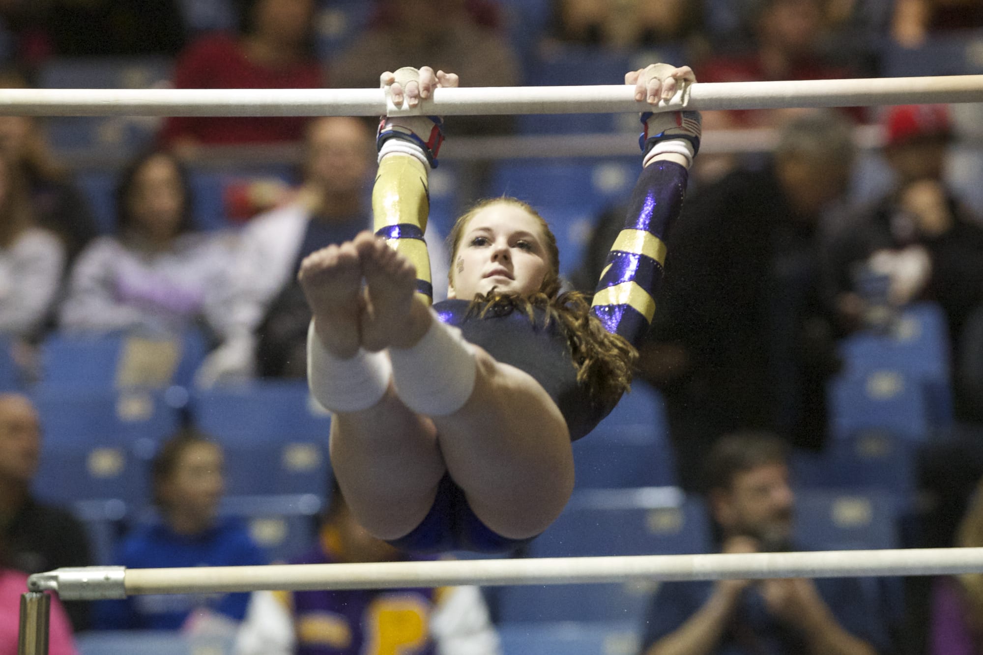 Columbia River's Katie Zink competes on the bars at the 3A state gymnastics meet in Tacoma on Friday.