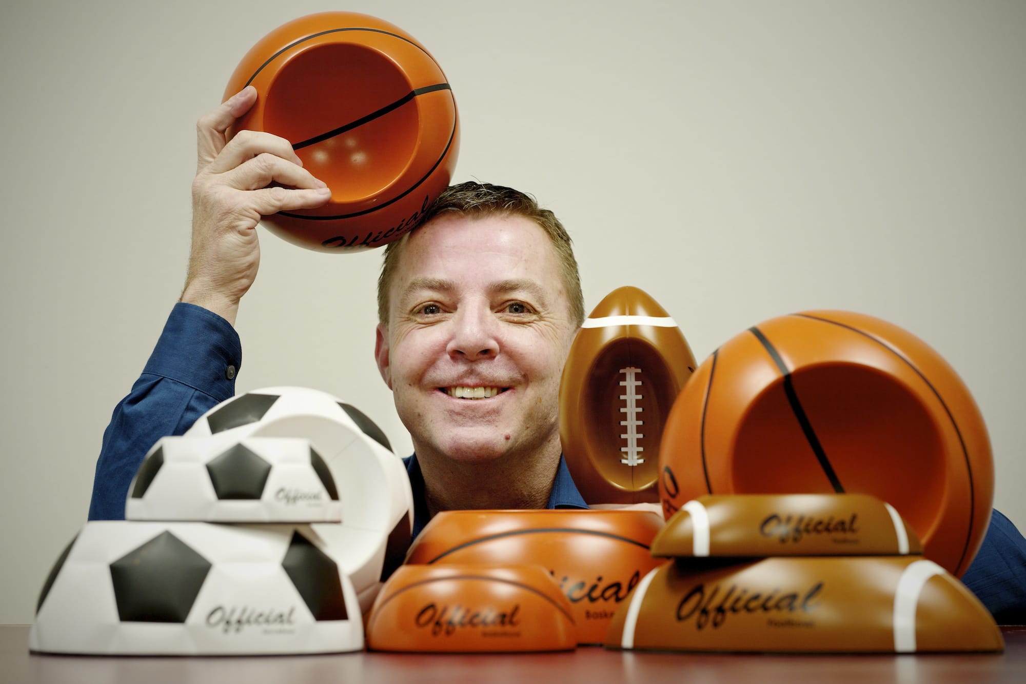 John Wirth, president and CEO of Remarkabowl, shows off some of his products at his company headquarters.