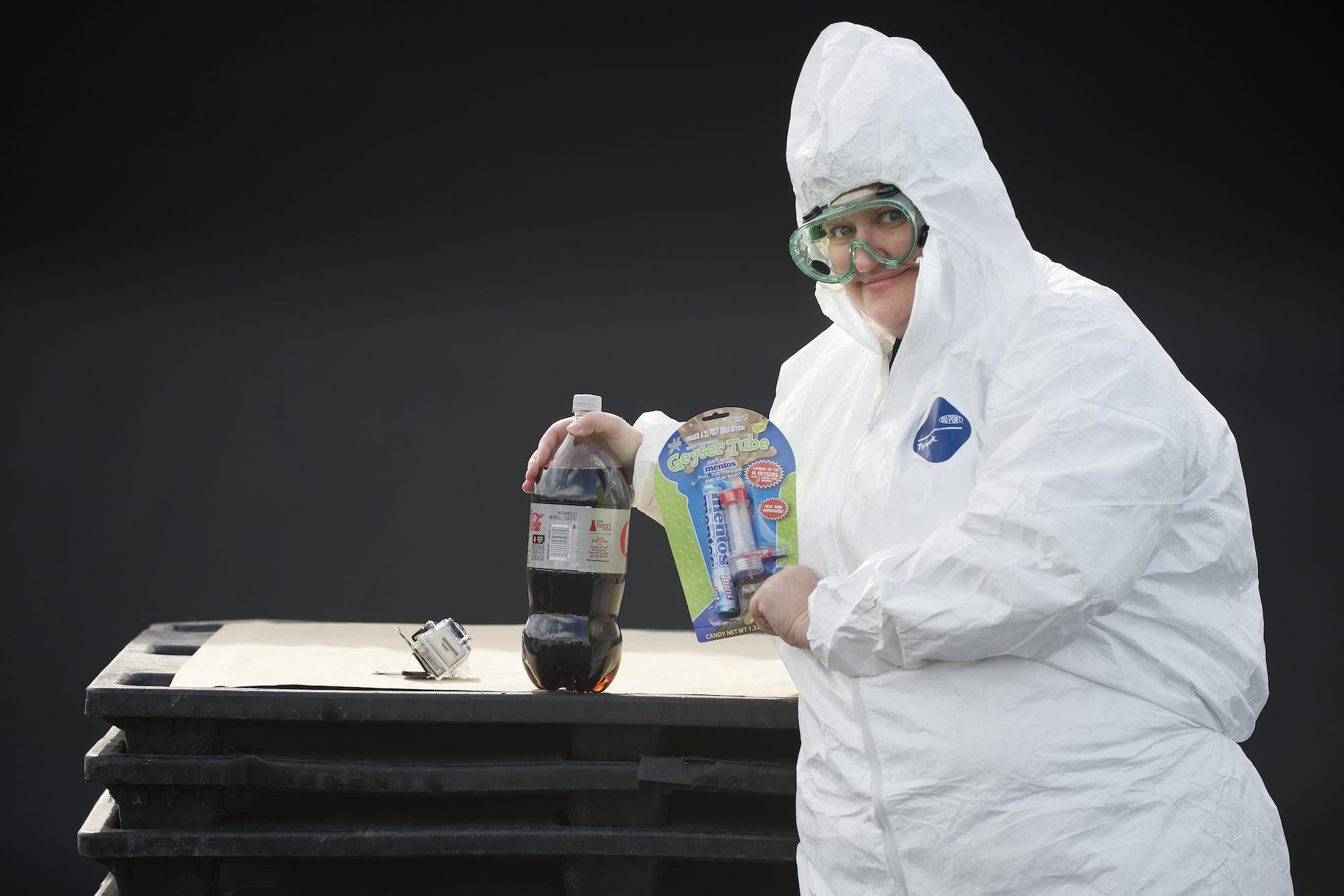 Columbian reporter Sue Vorenberg prepares to set off a diet-soda geyser.