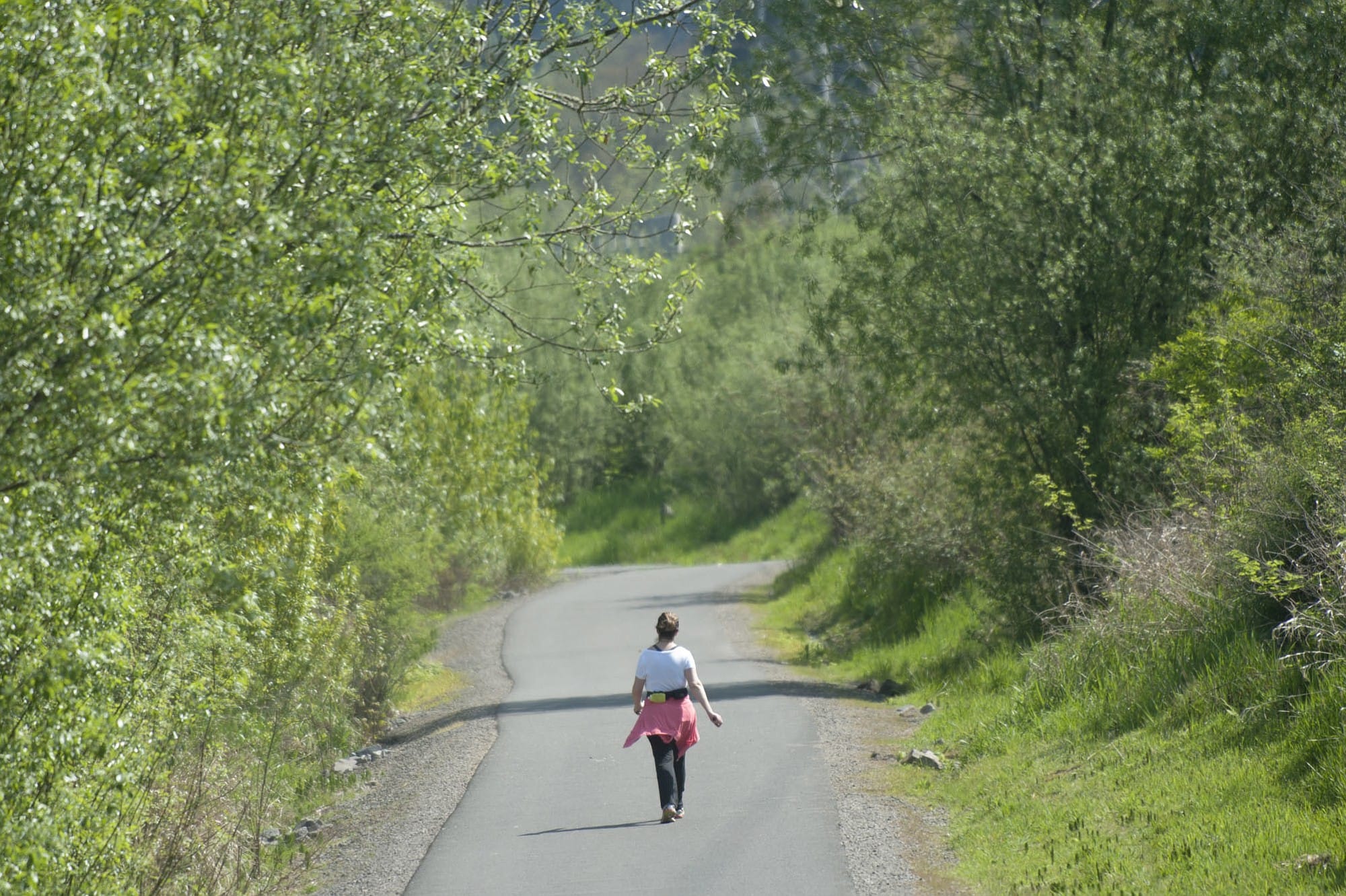 Roberta Marques Reis walks on the Burnt Bridge Creek Trail in Vancouver on Monday.