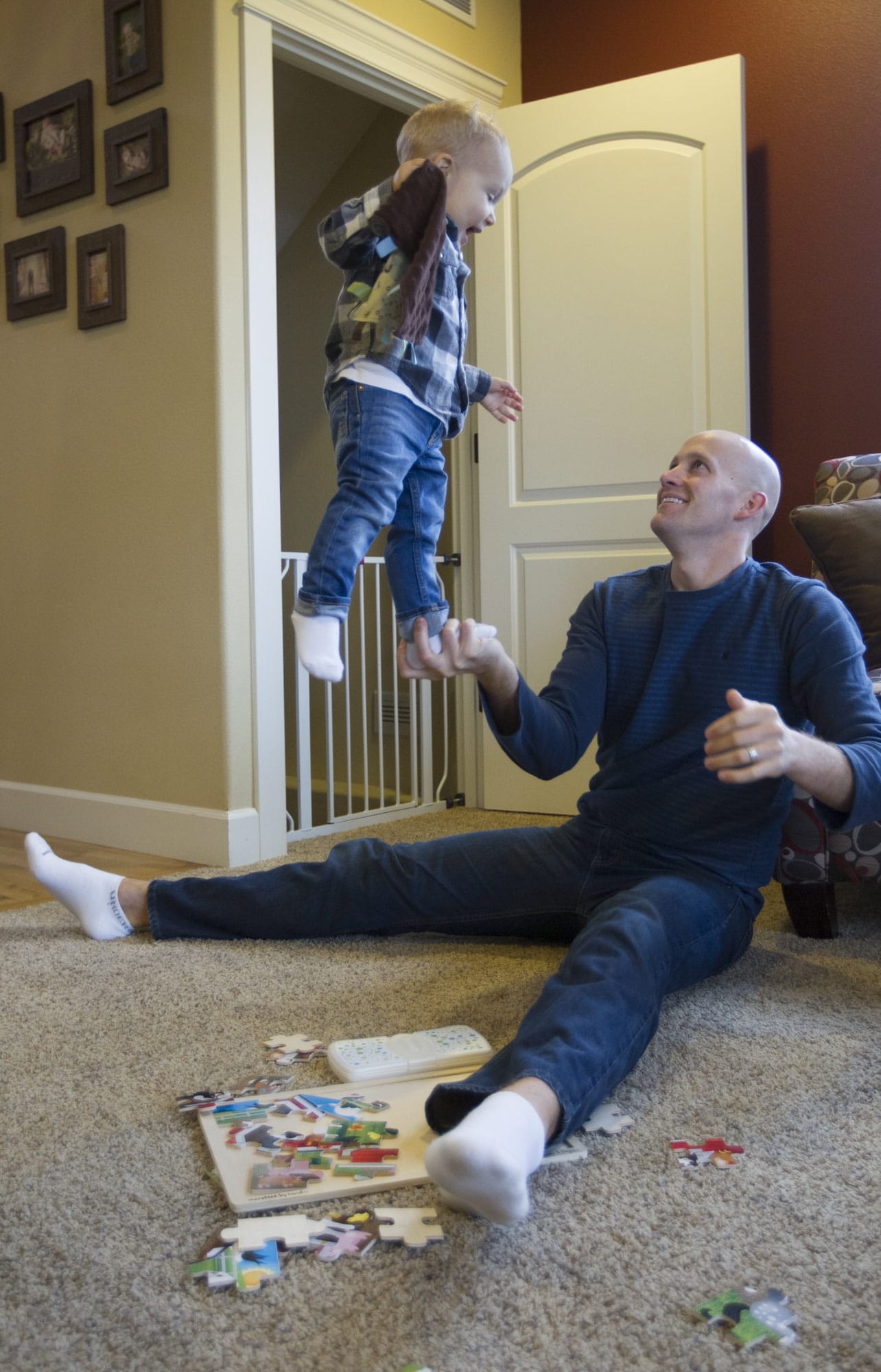 Kevin O'Neil plays with his son, Killian, in their Washougal home Dec. 18.