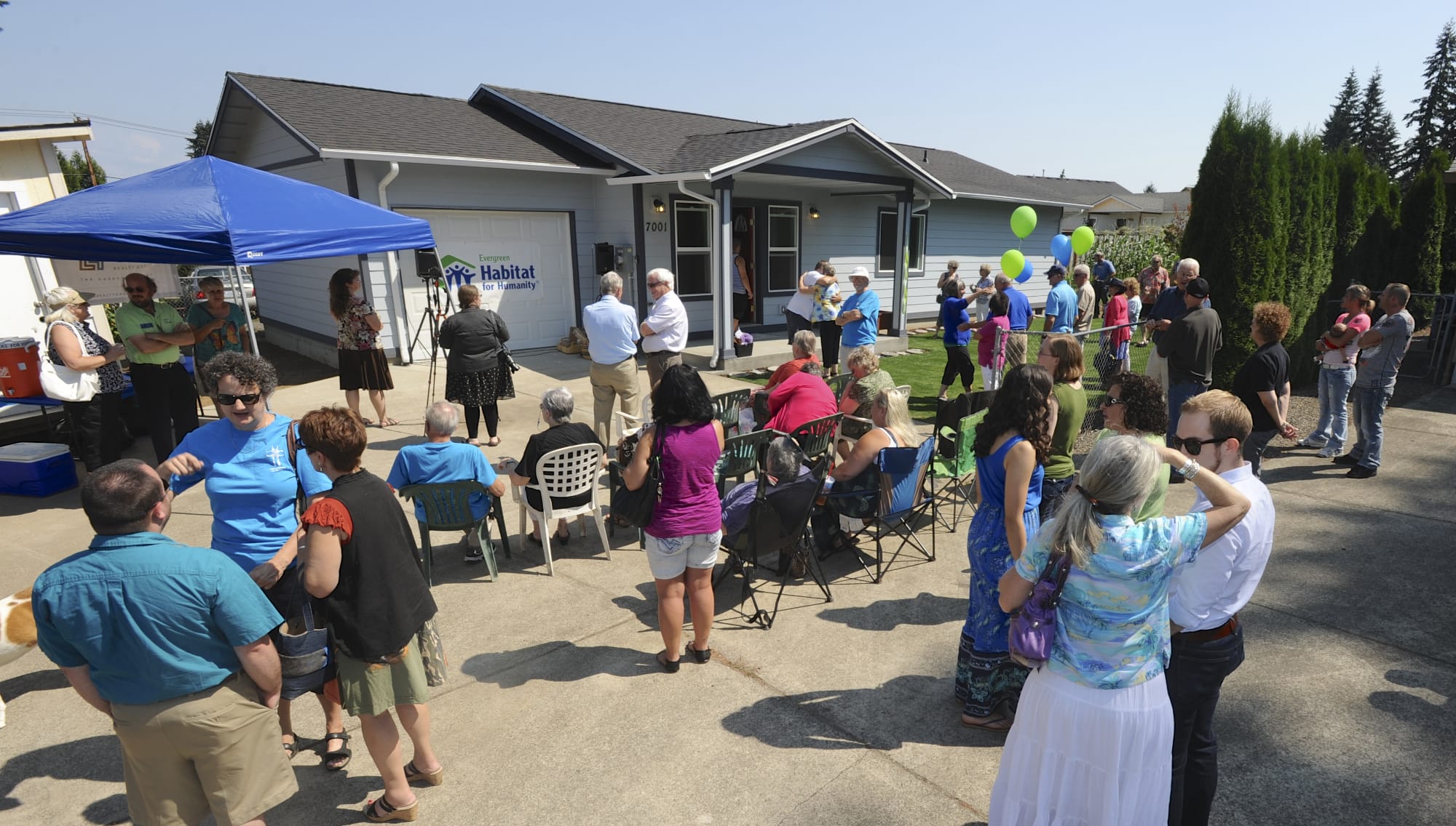 About 50 guests, donors and volunteers gathered for Sunday's dedication of the 30th local Habitat for Humanity home.