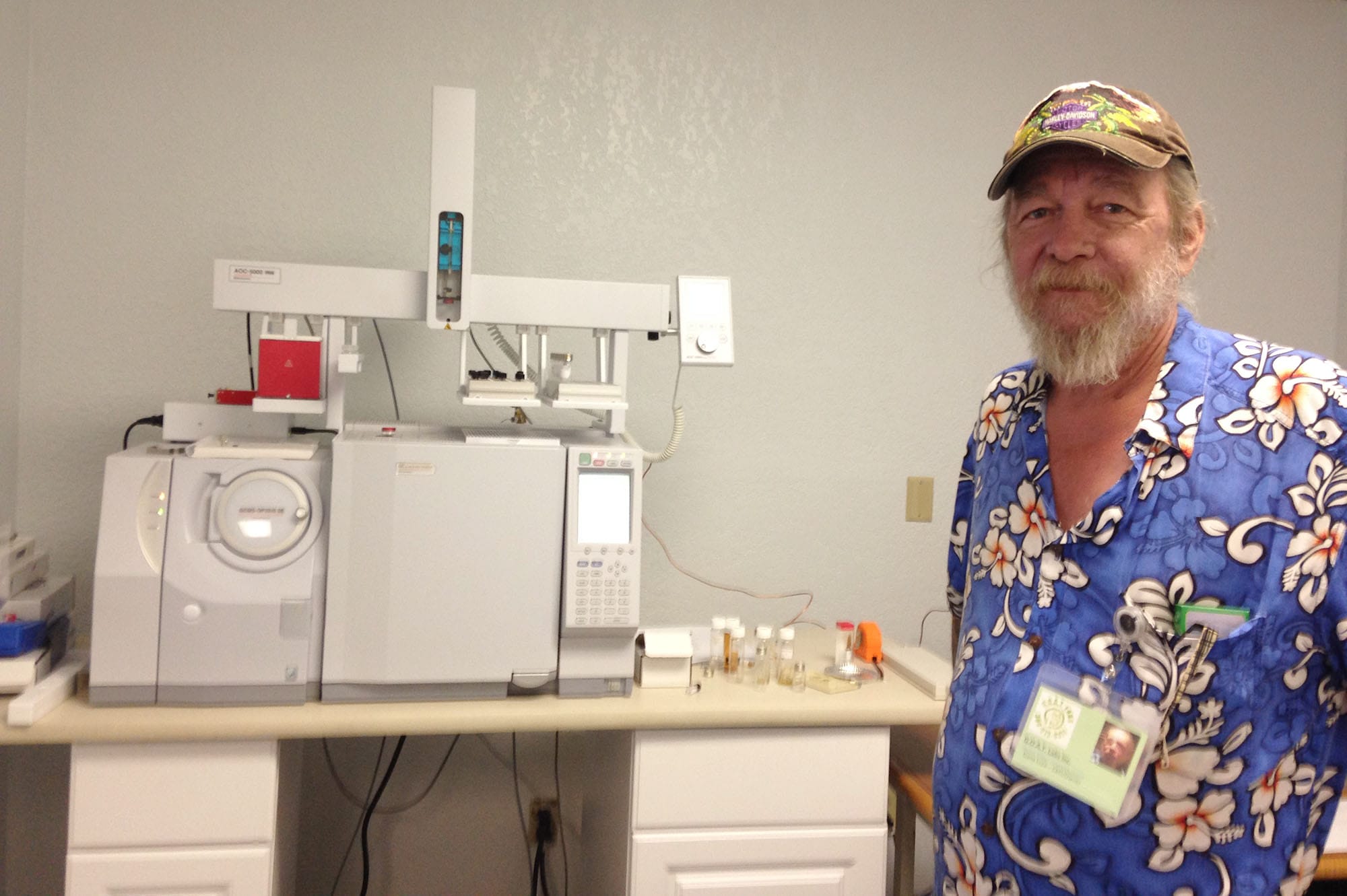 Dana Luce, owner of GOAT Labs, stands next to some of his testing equipment.