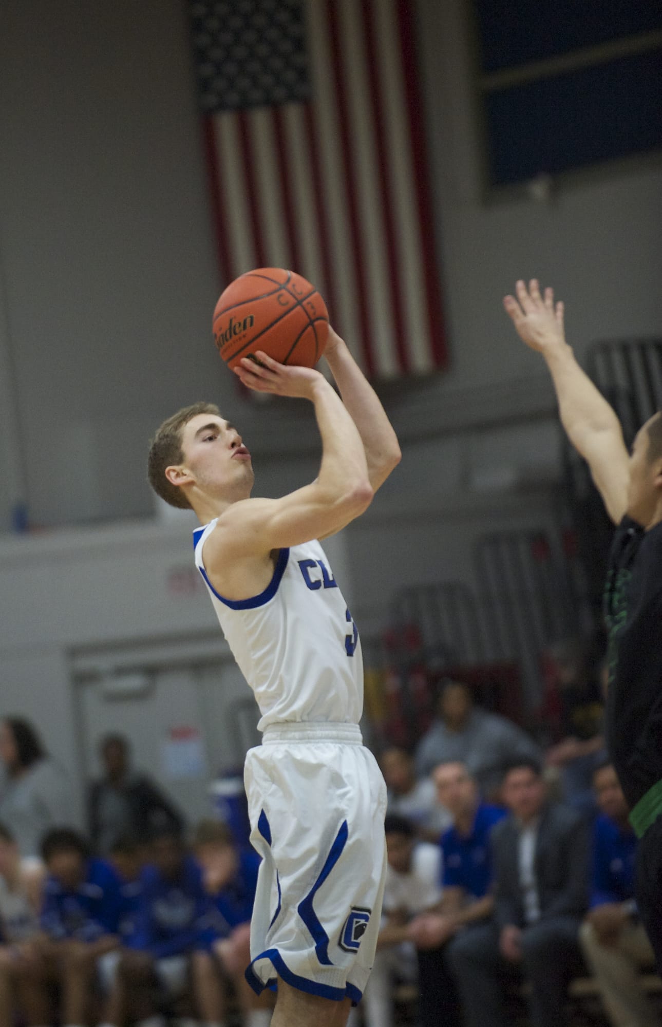 Clark's Kyle Thurston puts up a jump shot against Highline's Jimmy Keum in the first half at Clark on Saturday.
