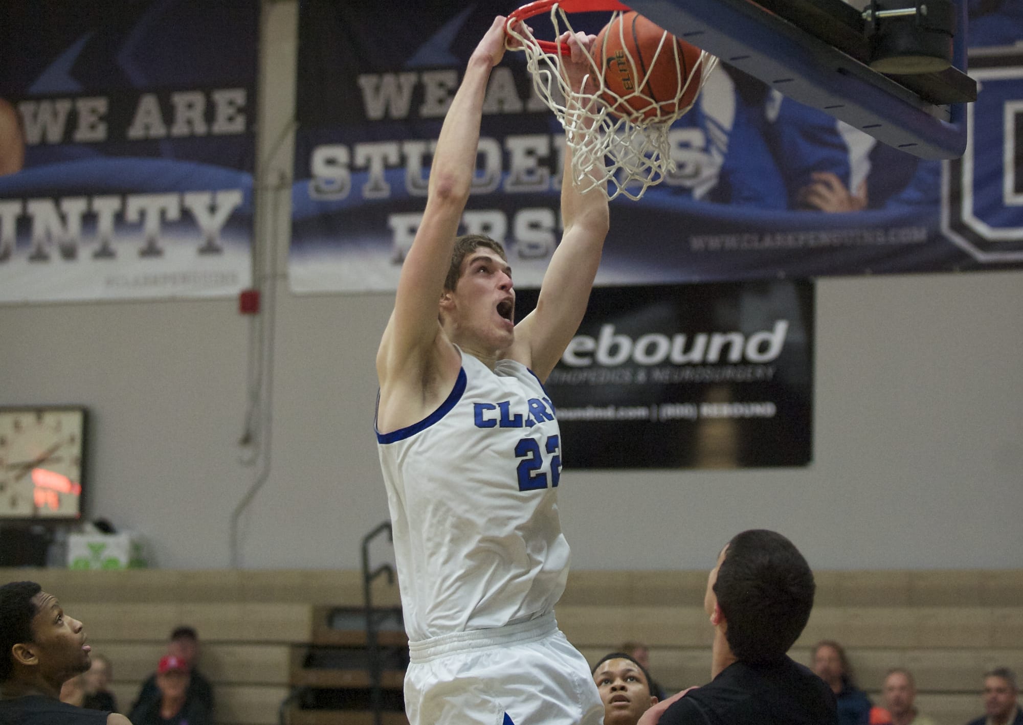 Clark's Collin Spickerman throws down a dunk in the first half against Highline on Saturday.