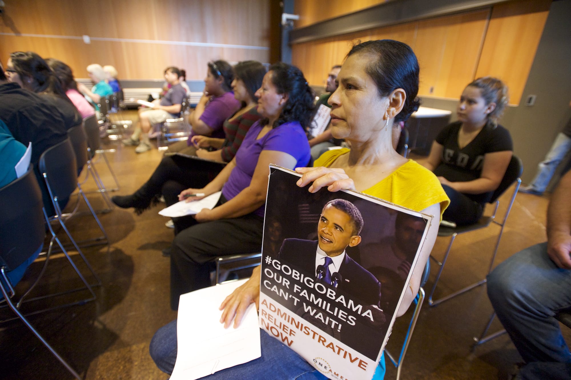 Gloria Torres of Vancouver attends a OneAmerica town hall meeting at the Vancouver Community Library on Thursday to show her support for changes to the nation's immigration policies.