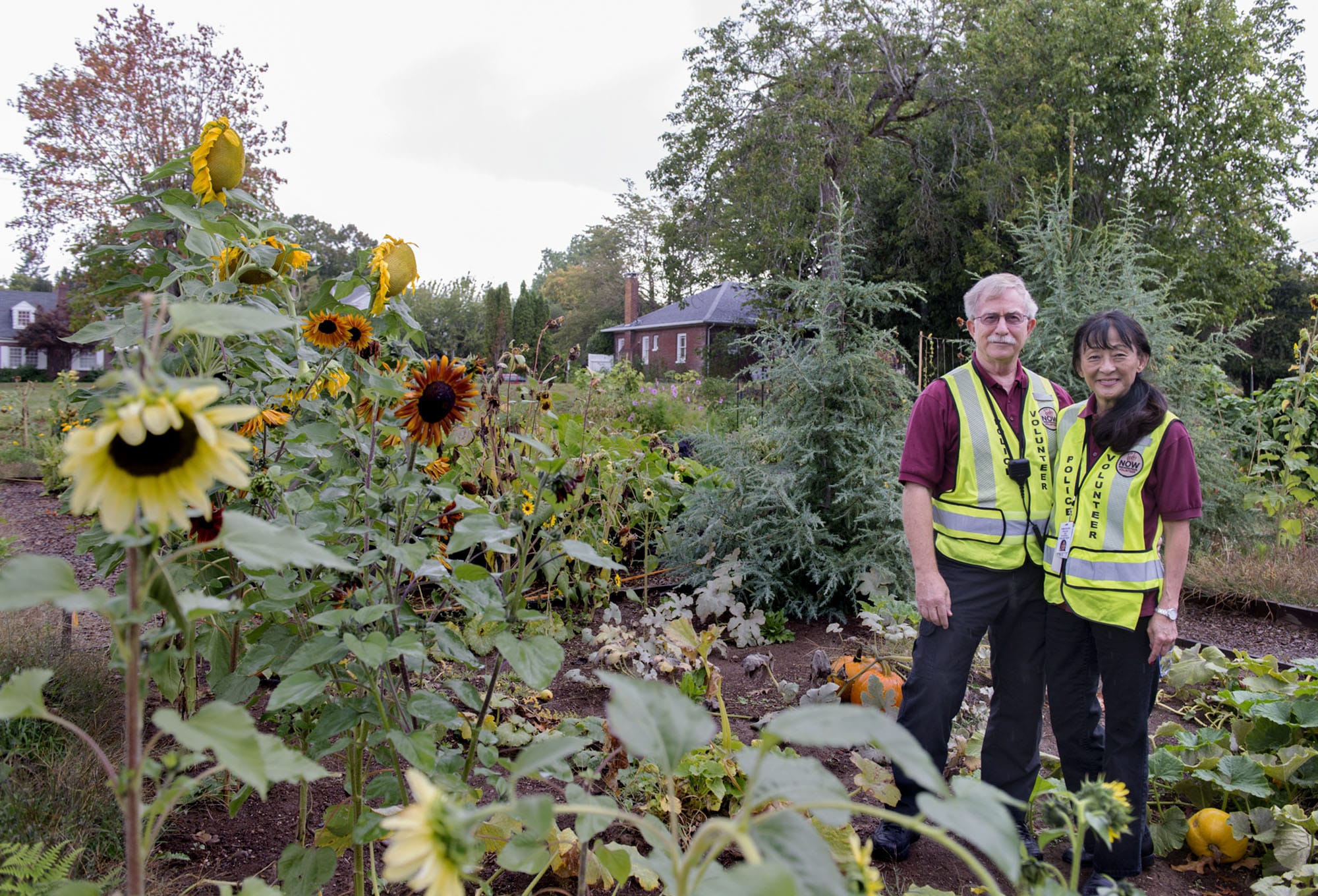Neighbors On Watch volunteers Andy Chumbley and Ann Glidewell were among the volunteers who have stepped up patrols around the Arnada Community Garden in Vancouver to help deter criminal activity.