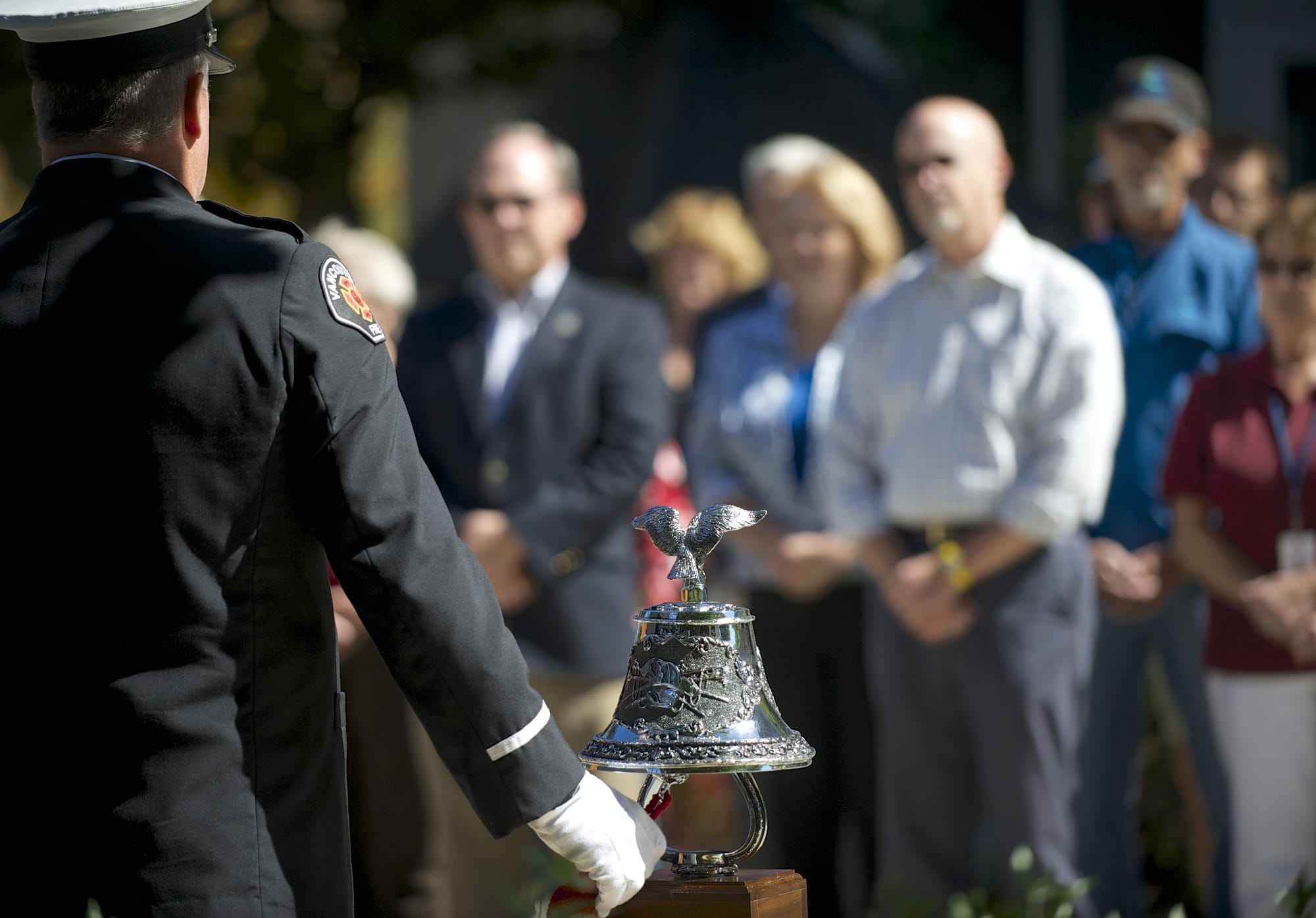 Zachary Kaufman/The Columbian
Vancouver Fire Capt. Perry LeDoux rings a bell to honor those who were lost on Sept.11, 2001.