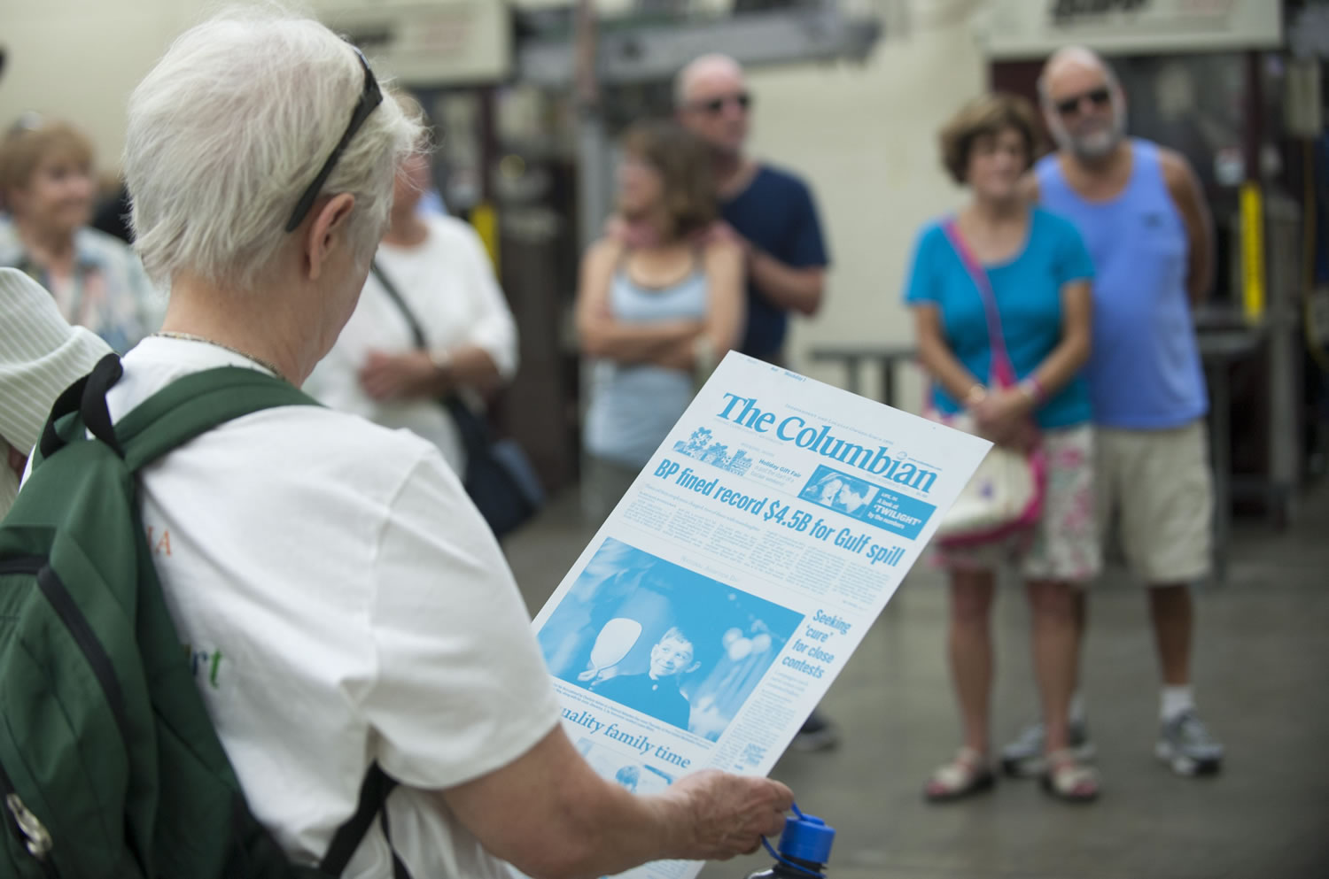 Visitors look at templates as they participate in a tour to see how the Columbian newspaper is printed in Vancouver Saturday. The event was held in advance of the Columbian newspaper's 125th anniversary, coming up in October.