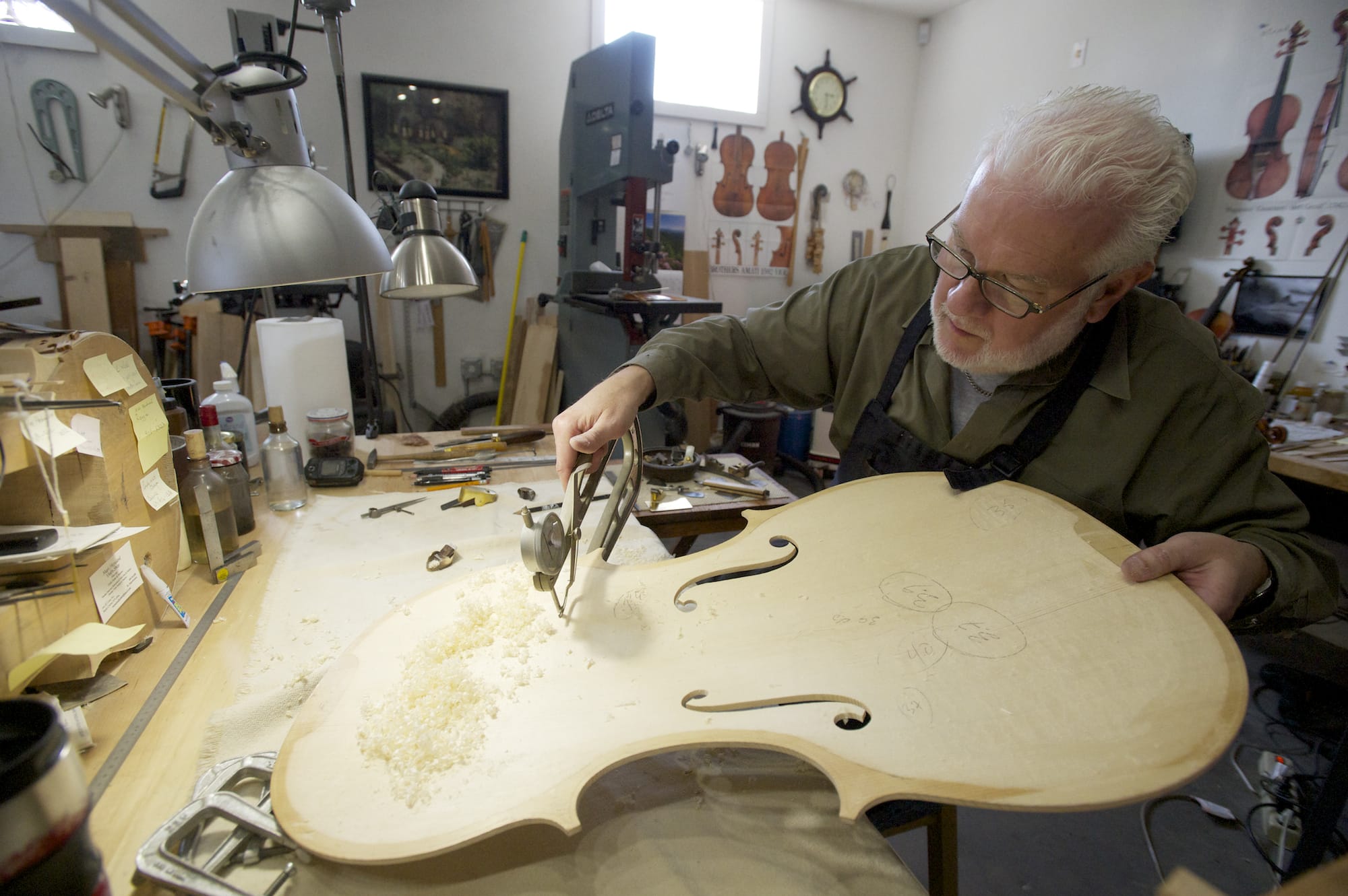 Photos by Steven Lane/The Columbian
Mark Moreland works on the body of a cello in his Battle Ground shop April 18.