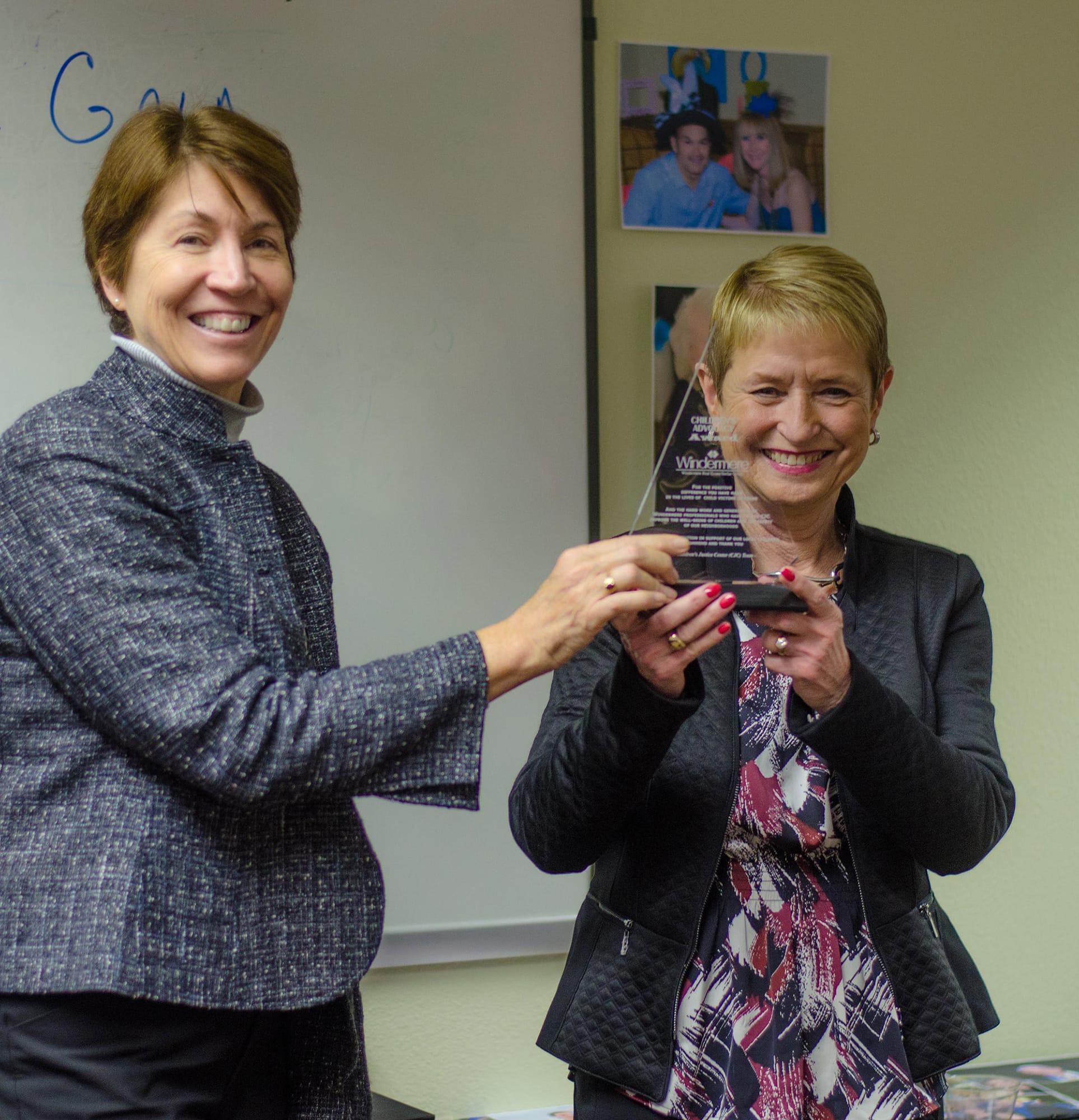 Hudson's Bay: Mary Blanchette, left, executive director of the Children's Justice Center, presents the center's Star Award to Gerry Dowdy Latshaw, managing principal broker for Windermere Stellar, for her fundraising efforts and support.